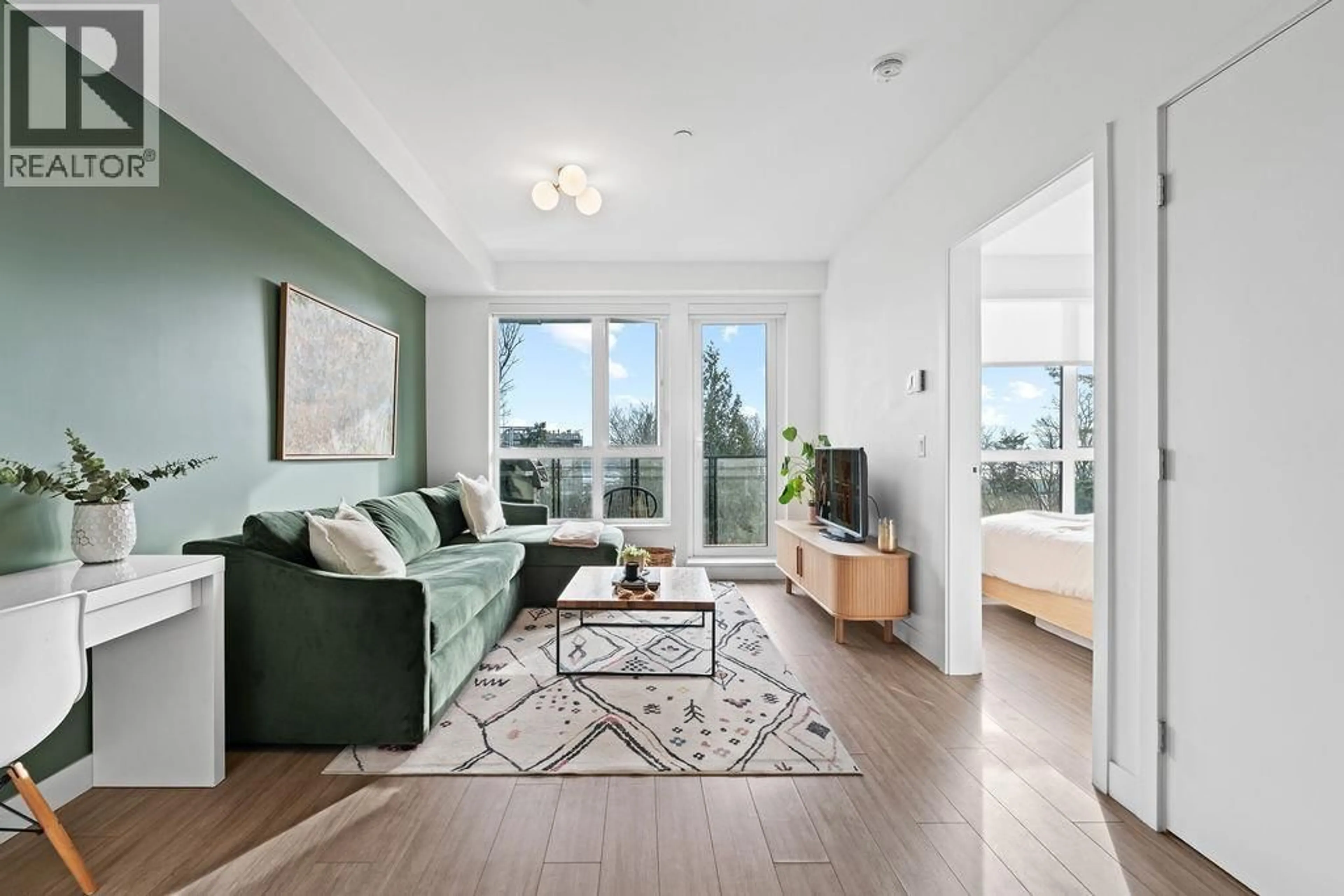 Living room with furniture, wood/laminate floor for 309 - 747 3RD STREET, North Vancouver British Columbia V7L1G8