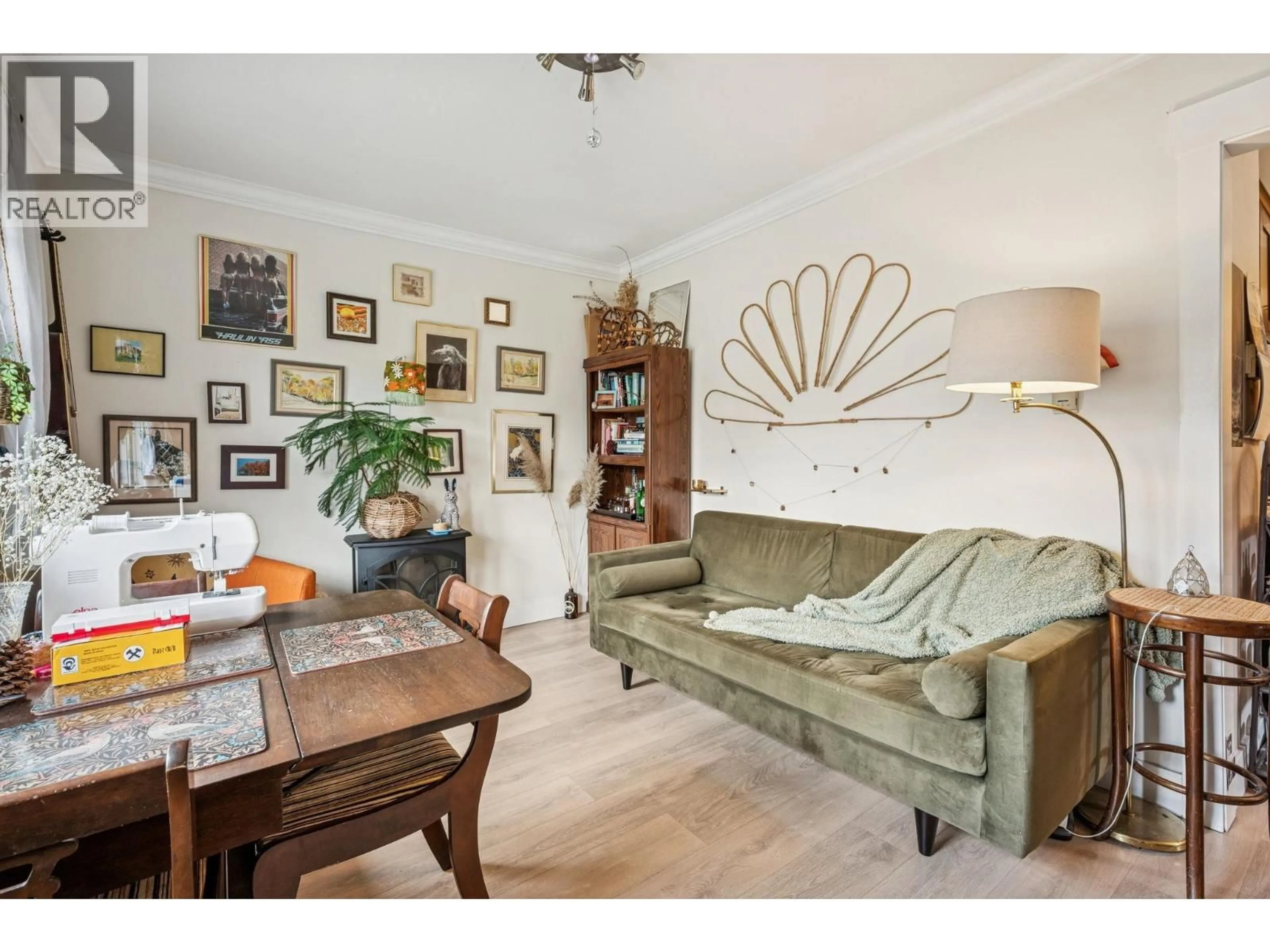 Living room with furniture, wood/laminate floor for 2148 - 2150 FERNDALE STREET, Vancouver British Columbia V5L1Y4