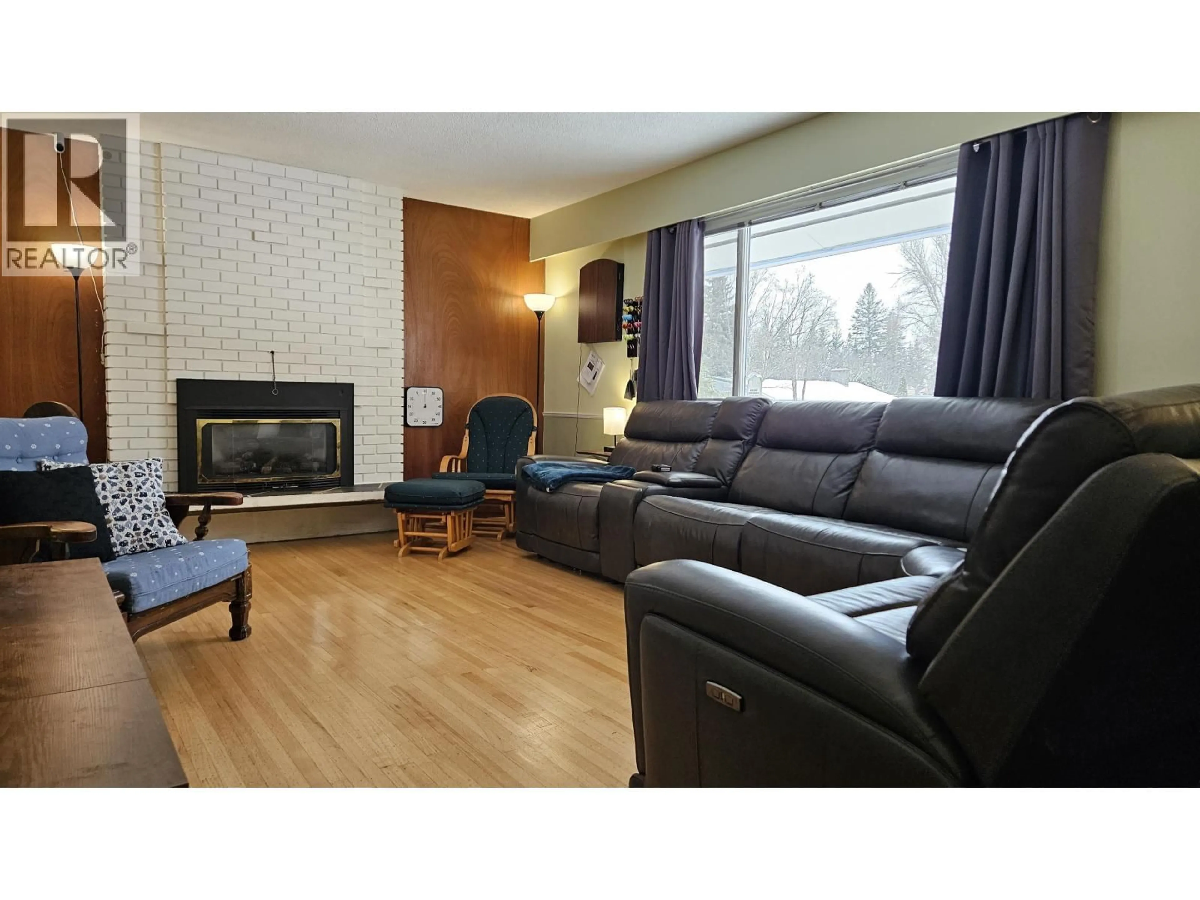 Living room with furniture, wood/laminate floor for 1787 HARPER DRIVE, Prince George British Columbia V2M2Y9