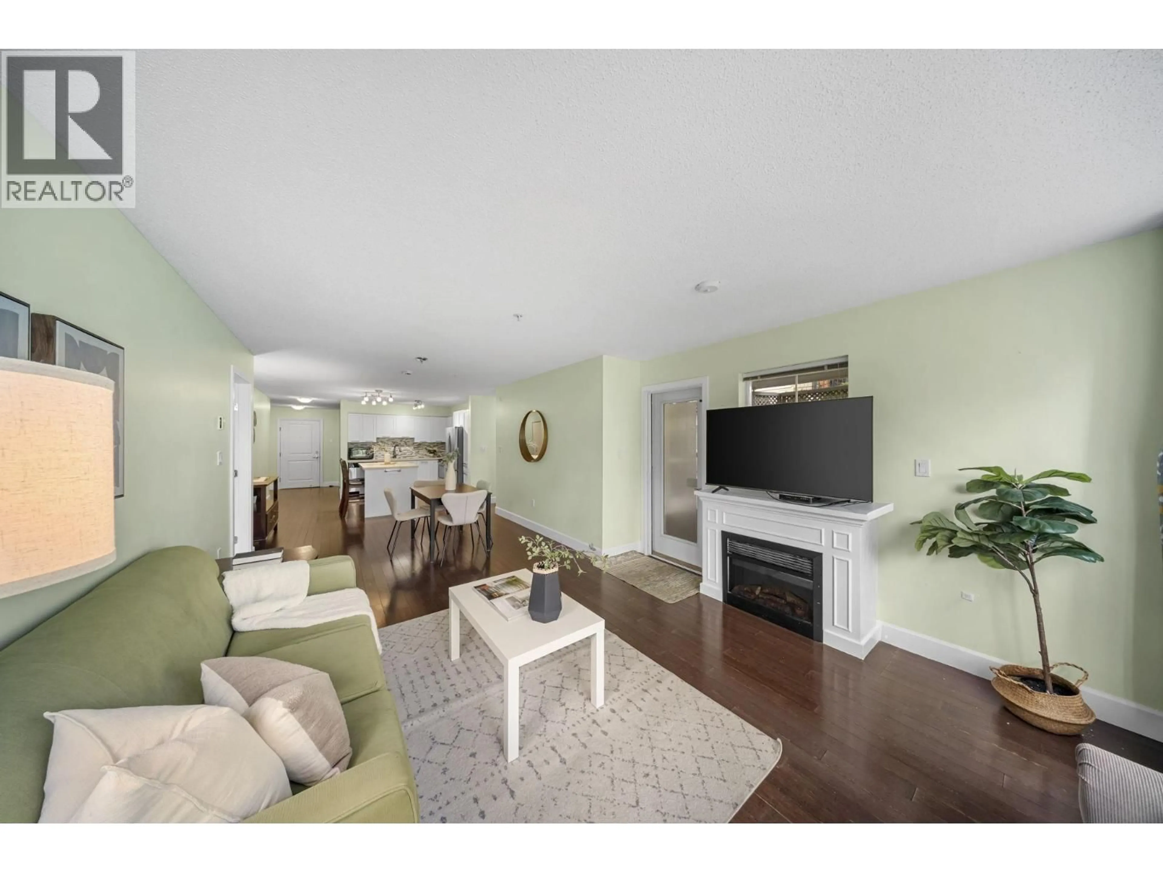 Living room with furniture, wood/laminate floor for 120 - 19677 MEADOW GARDENS WAY, Pitt Meadows British Columbia V3Y0A2