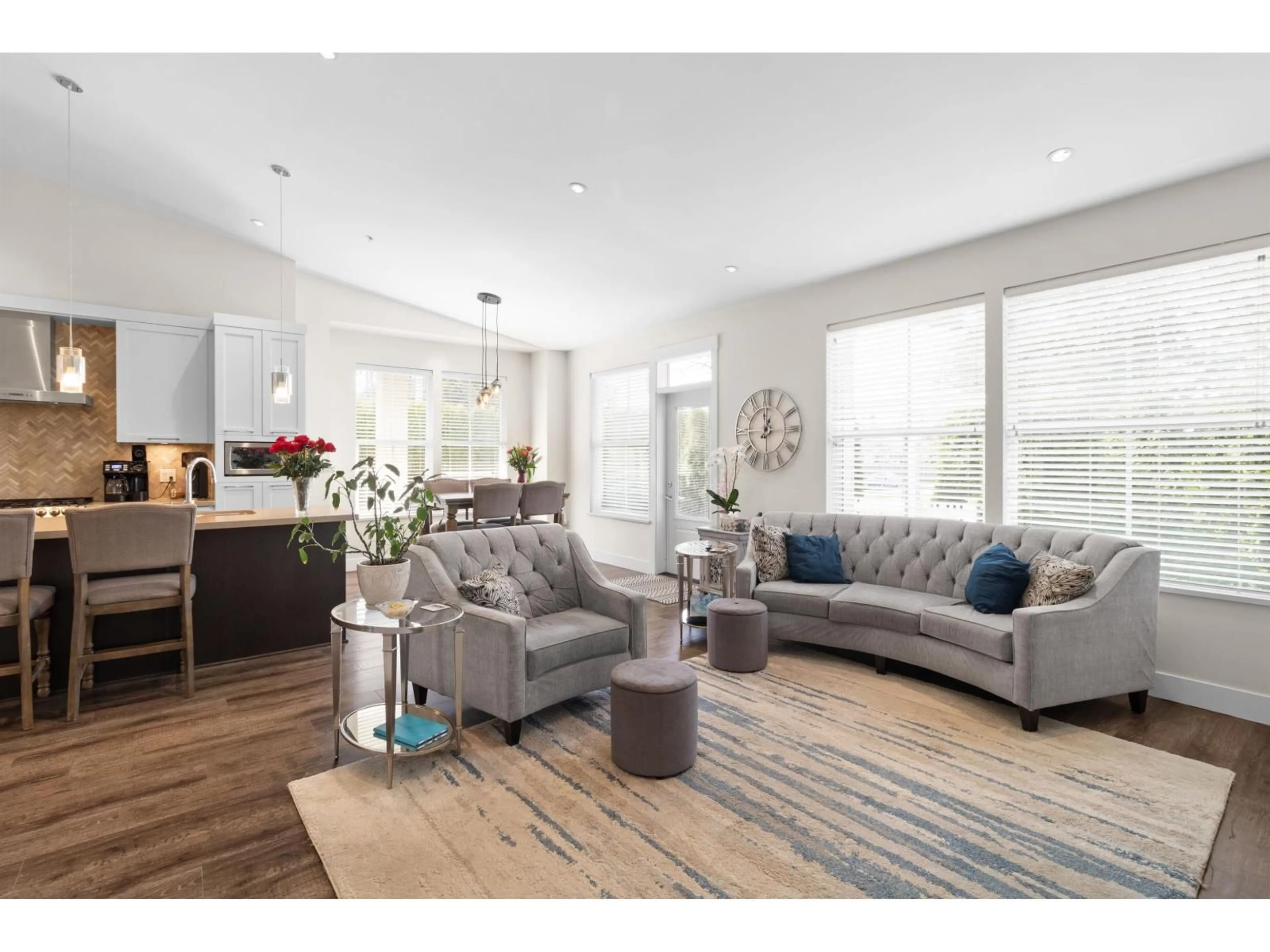 Living room with furniture, wood/laminate floor for 48 - 22057 49 AVENUE, Langley British Columbia V3A0J4