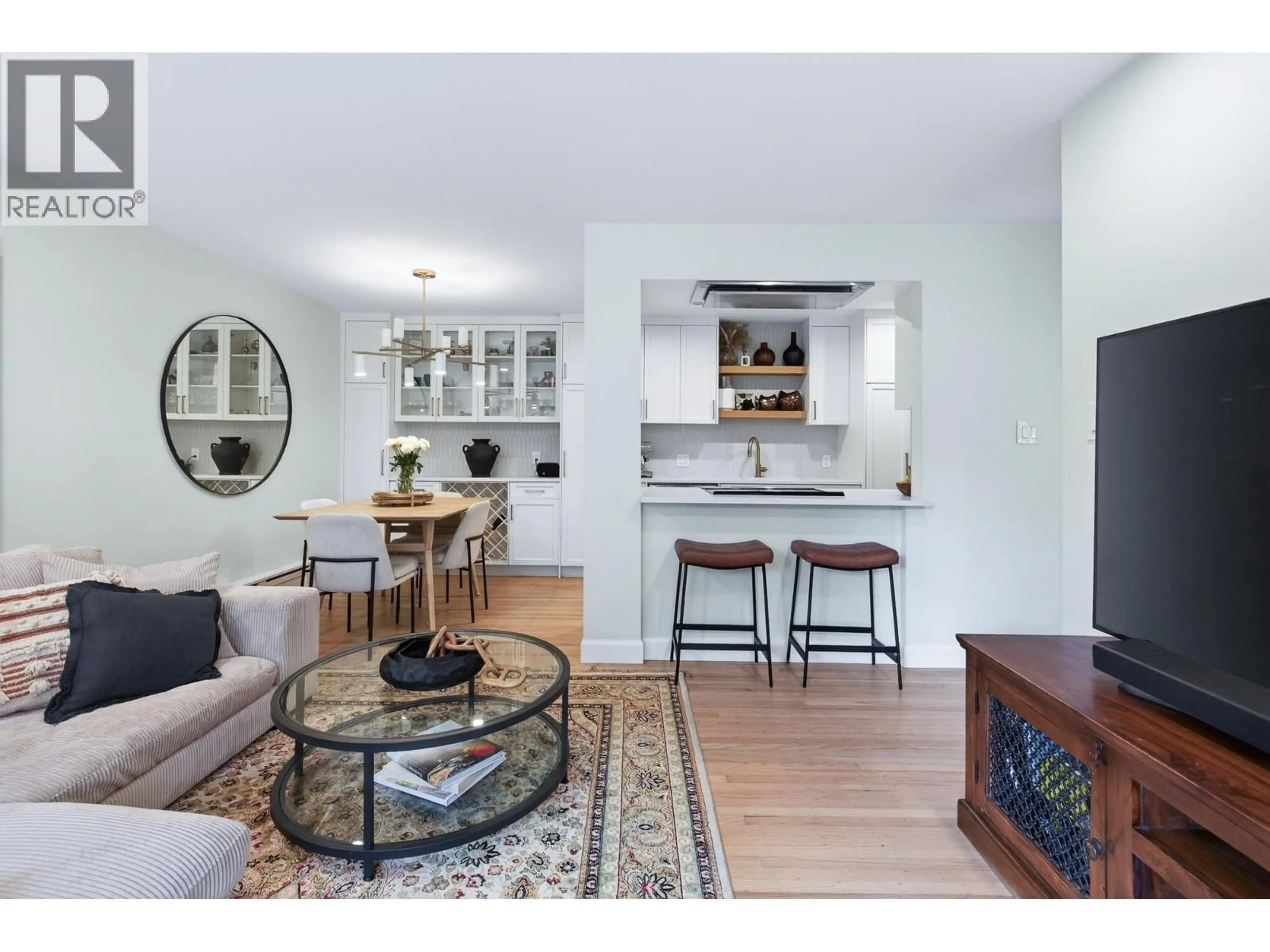 Open concept kitchen, wood/laminate floor for 108 - 1424 WALNUT STREET, Vancouver British Columbia V6J3R3