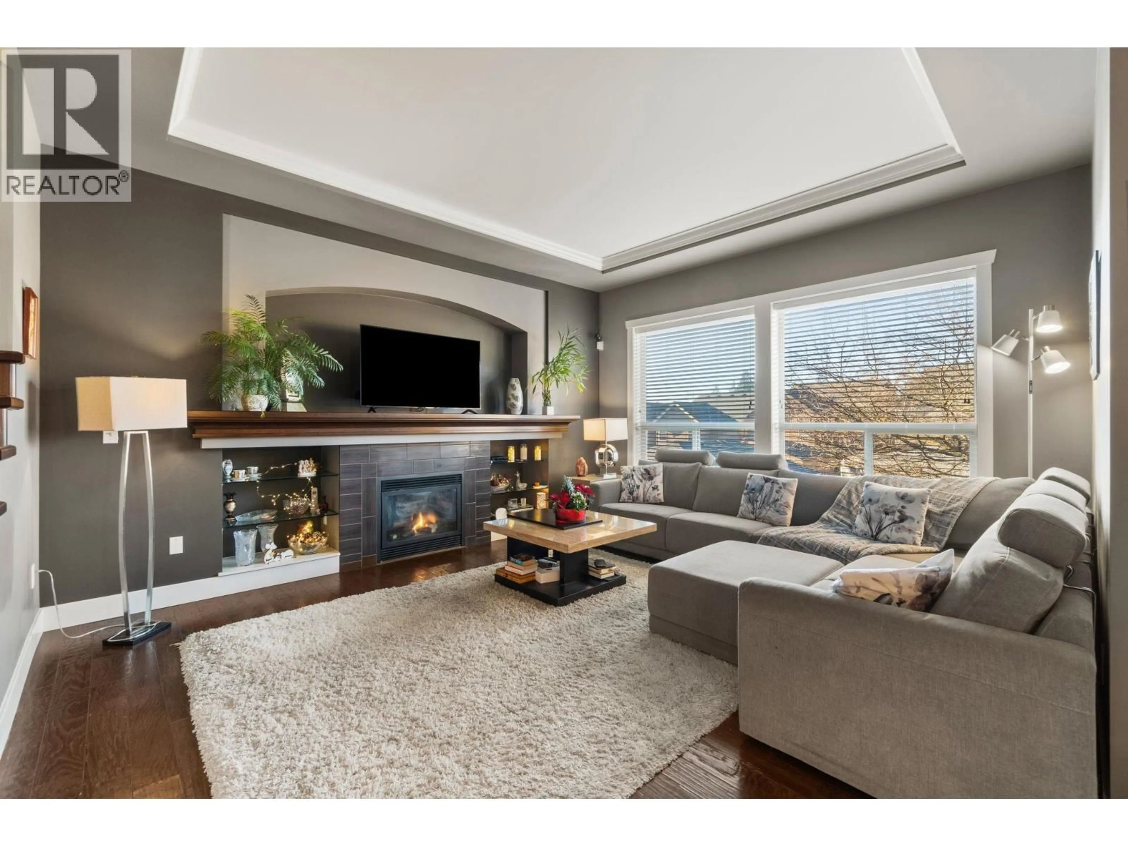 Living room with furniture, wood/laminate floor for 1386 COAST MERIDIAN ROAD, Coquitlam British Columbia V3E3H1