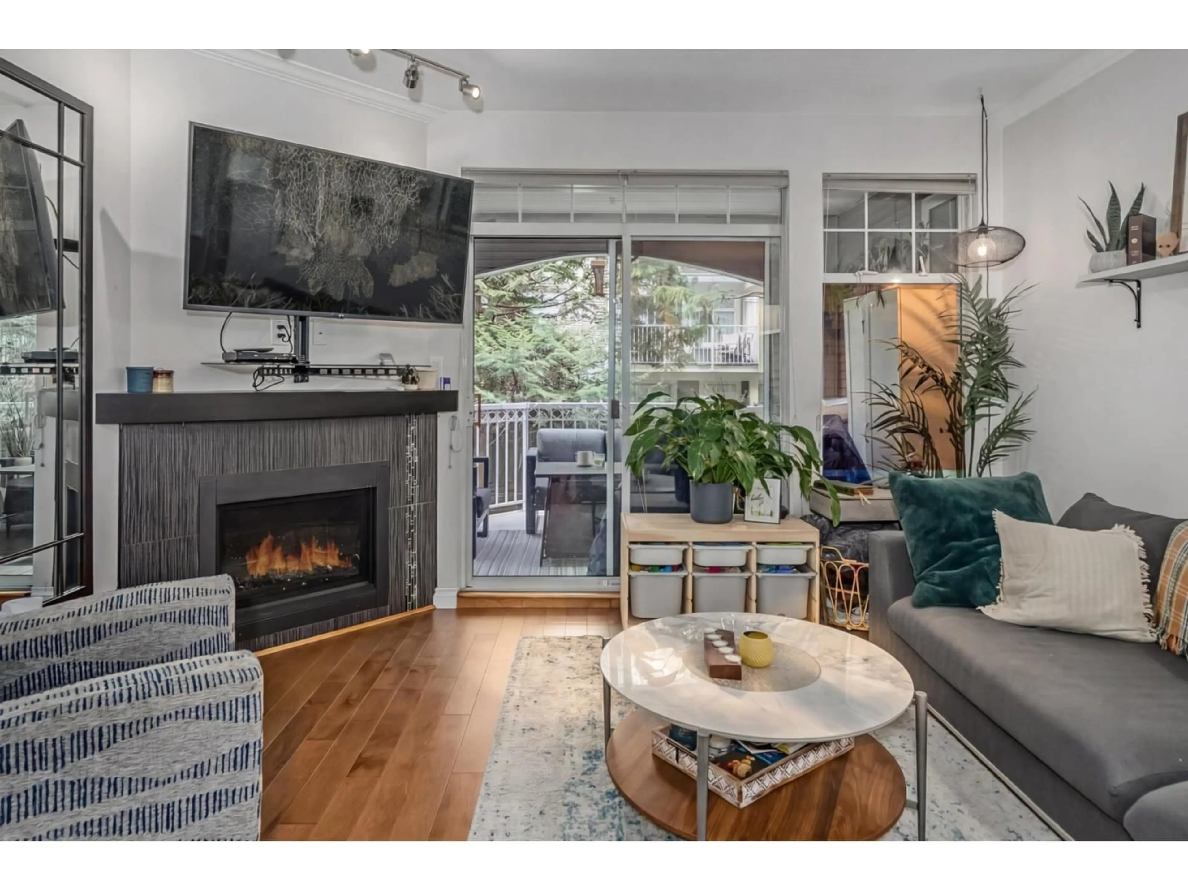 Living room with furniture, wood/laminate floor for 112 - 5677 208 STREET, Langley British Columbia V3A8J5