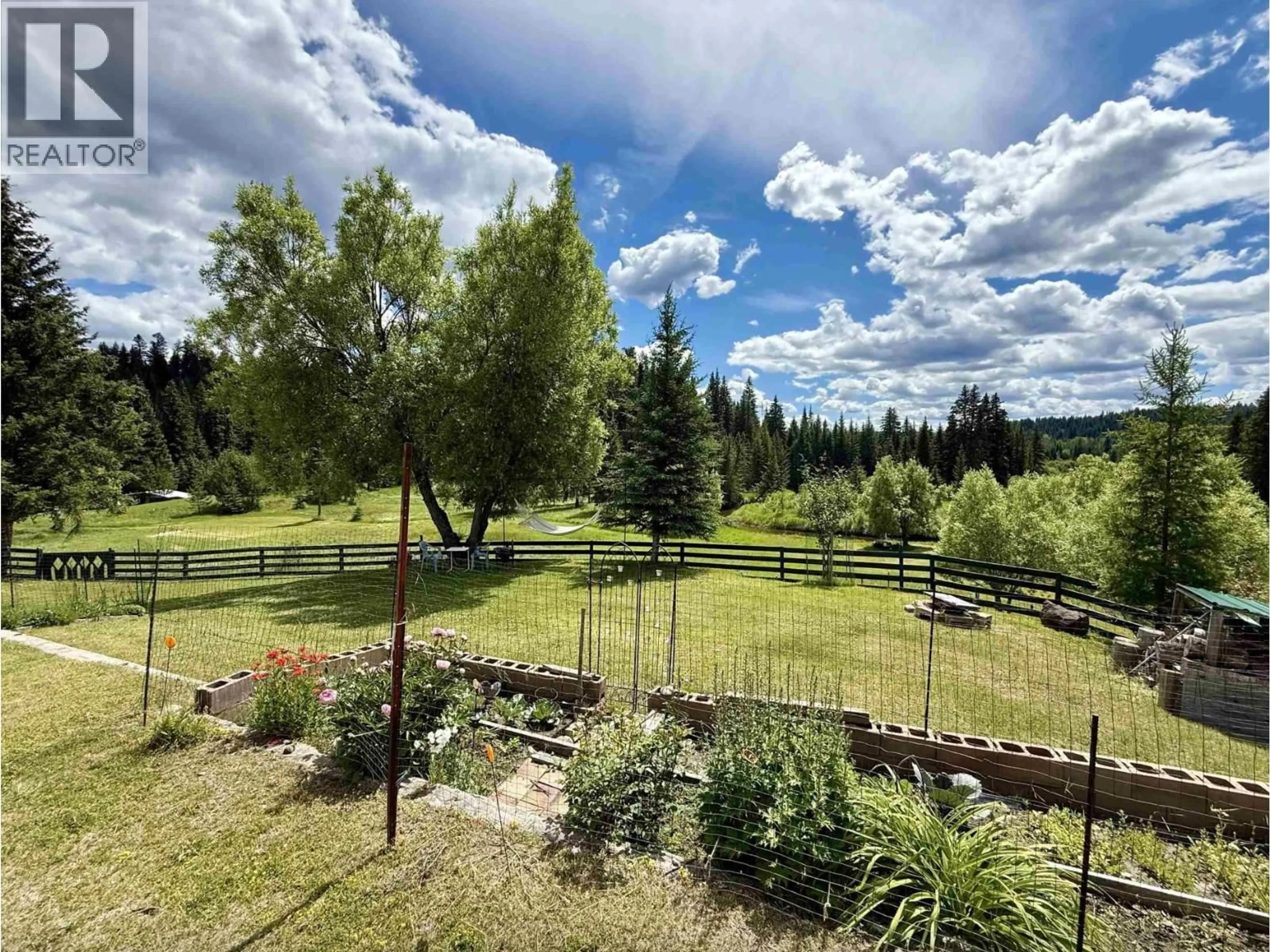 A pic from outside/outdoor area/front of a property/back of a property/a pic from drone, forest/trees view for 5307 CANIM HENDRIX LAKE ROAD, 100 Mile House British Columbia V0K2E1