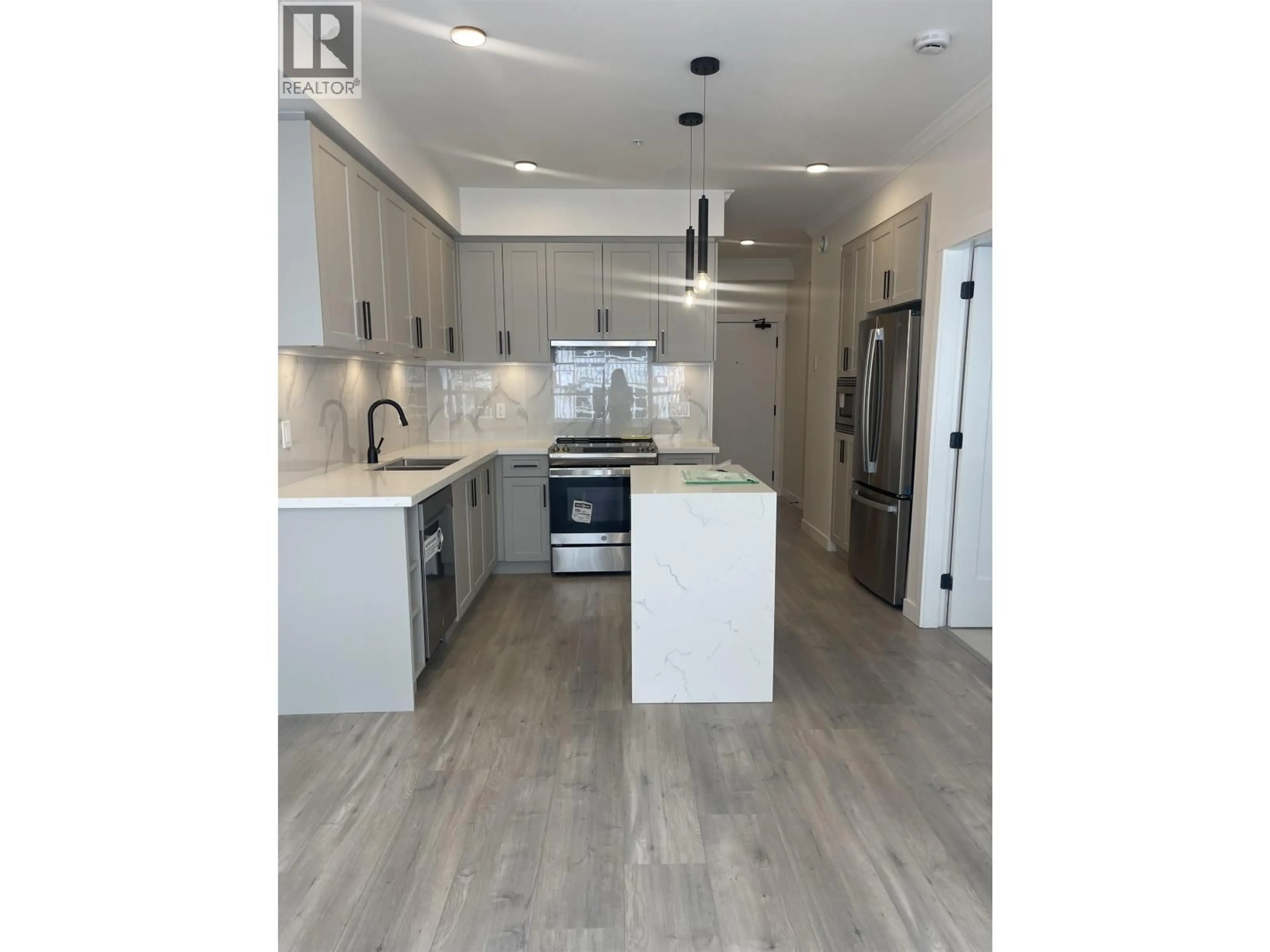 Open concept kitchen, wood/laminate floor for 228 - 12109 223 STREET, Maple Ridge British Columbia V2X5Y6