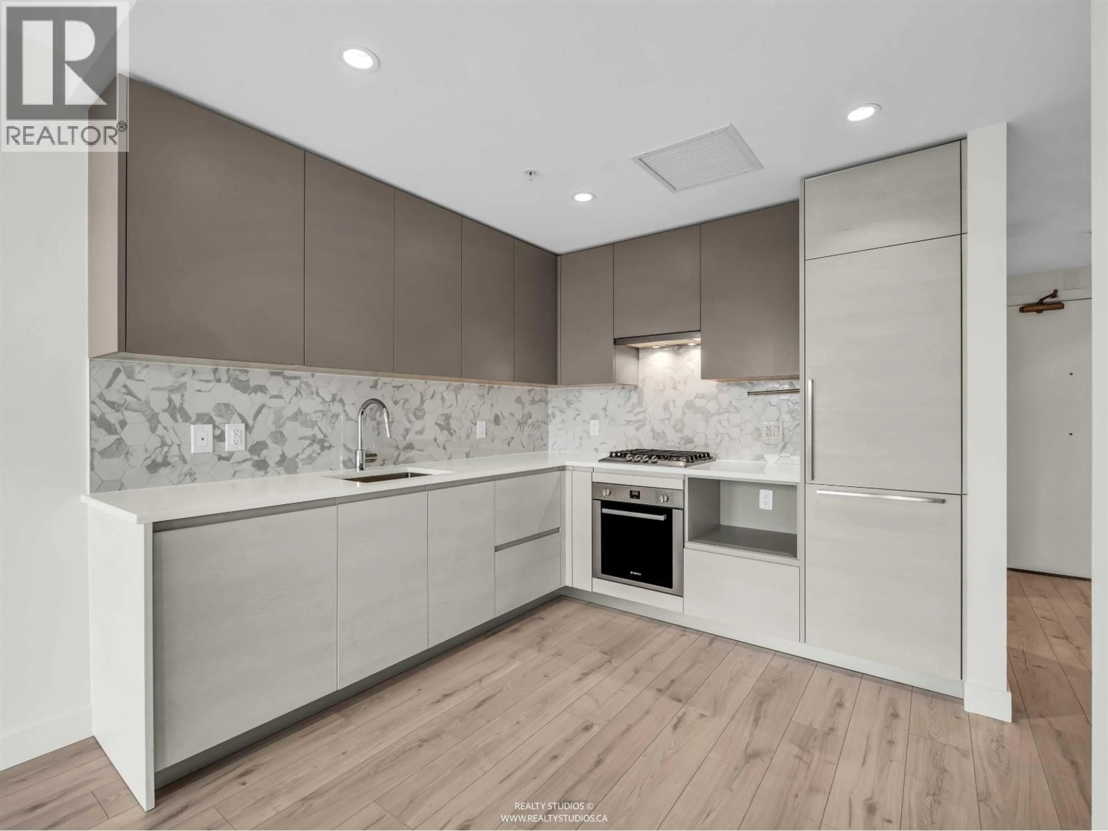 Open concept kitchen, ceramic/tile floor for 1302 - 8181 CHESTER STREET, Vancouver British Columbia V5X0J9