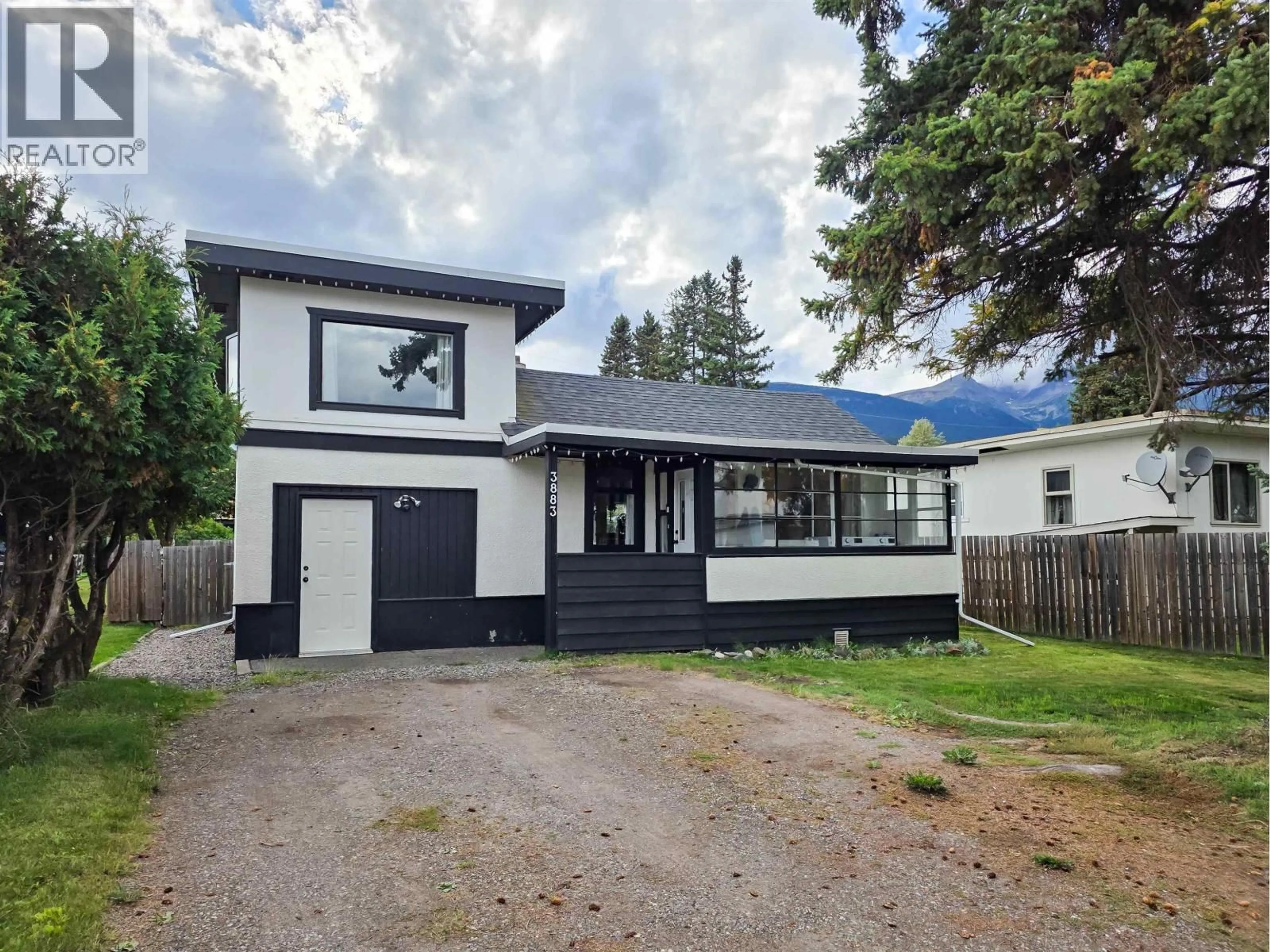 Home with vinyl exterior material, street for 3883 3RD AVENUE, Smithers British Columbia V0J2N0
