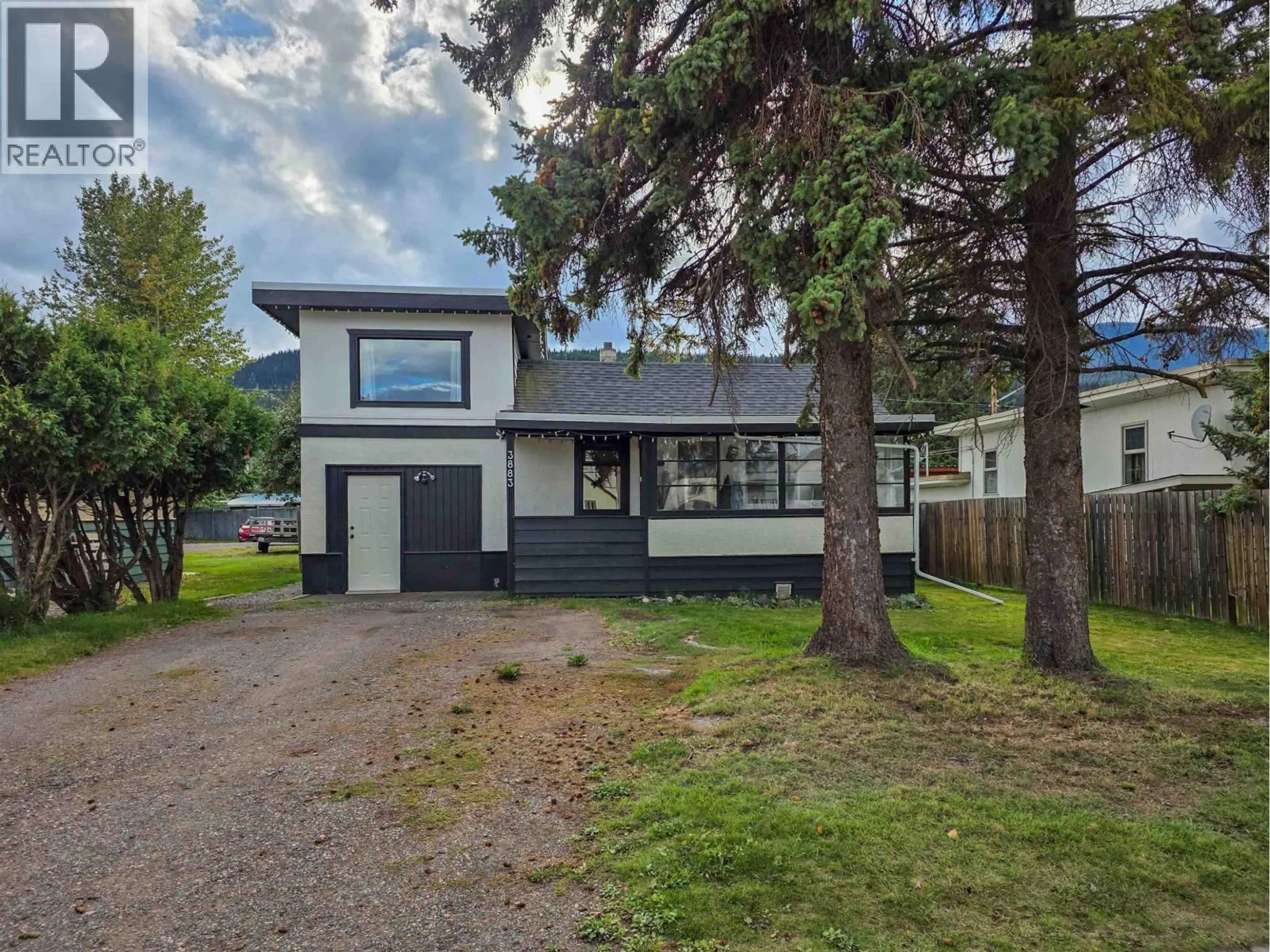 Home with vinyl exterior material, street for 3883 3RD AVENUE, Smithers British Columbia V0J2N0