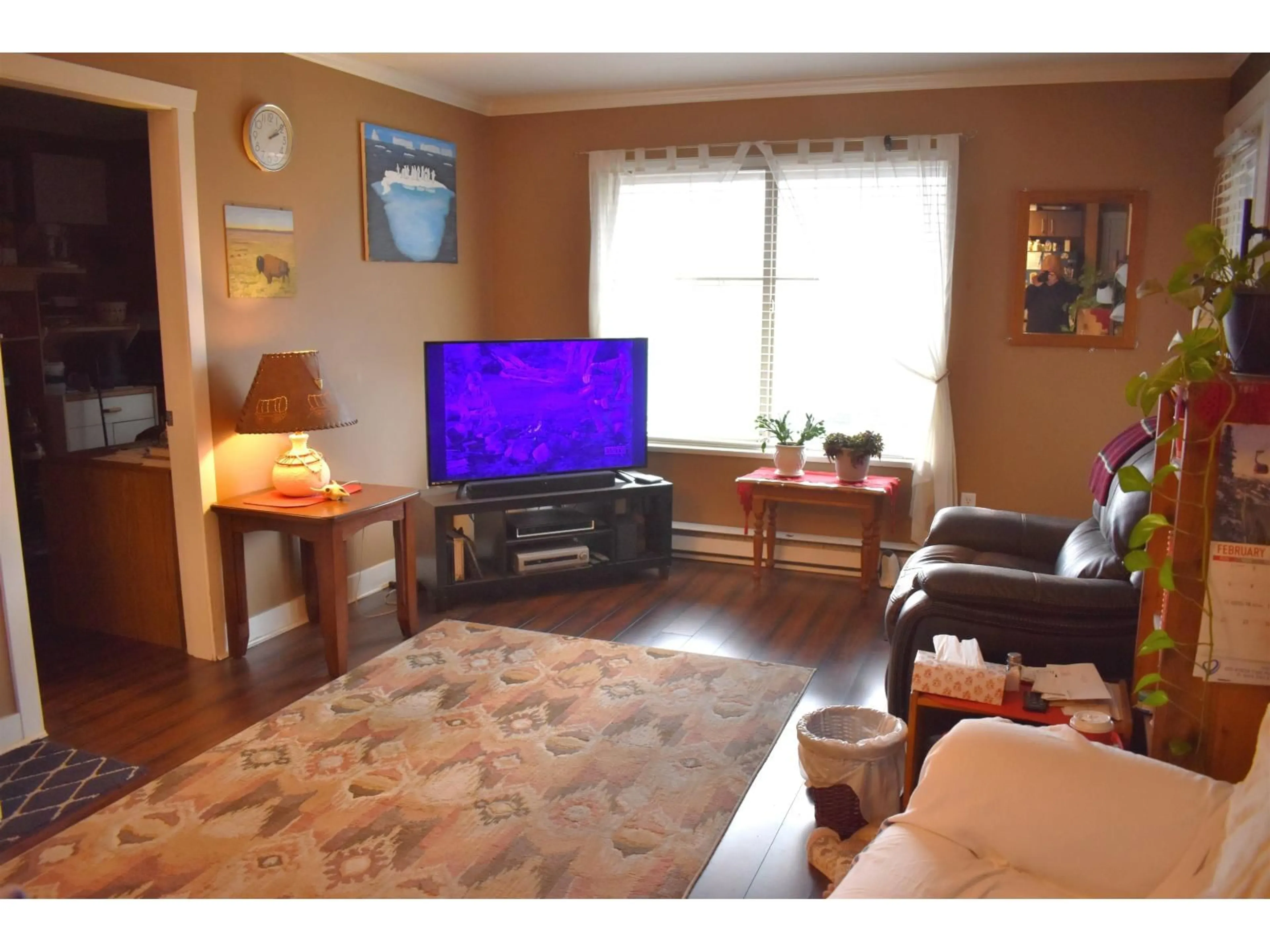 Living room with furniture, wood/laminate floor for 402 - 45559 YALE ROAD, Chilliwack British Columbia V2P0B1