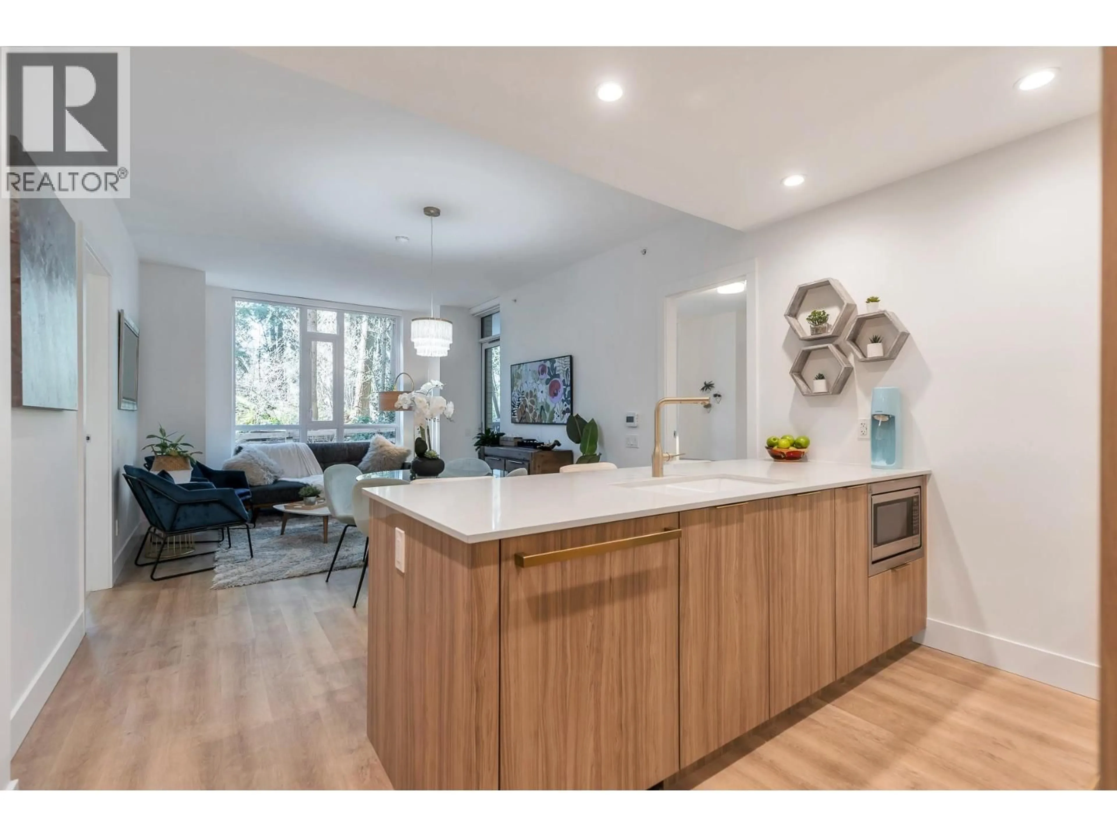 Open concept kitchen, wood/laminate floor for 109 - 2325 EMERY COURT, North Vancouver British Columbia V7J0E8