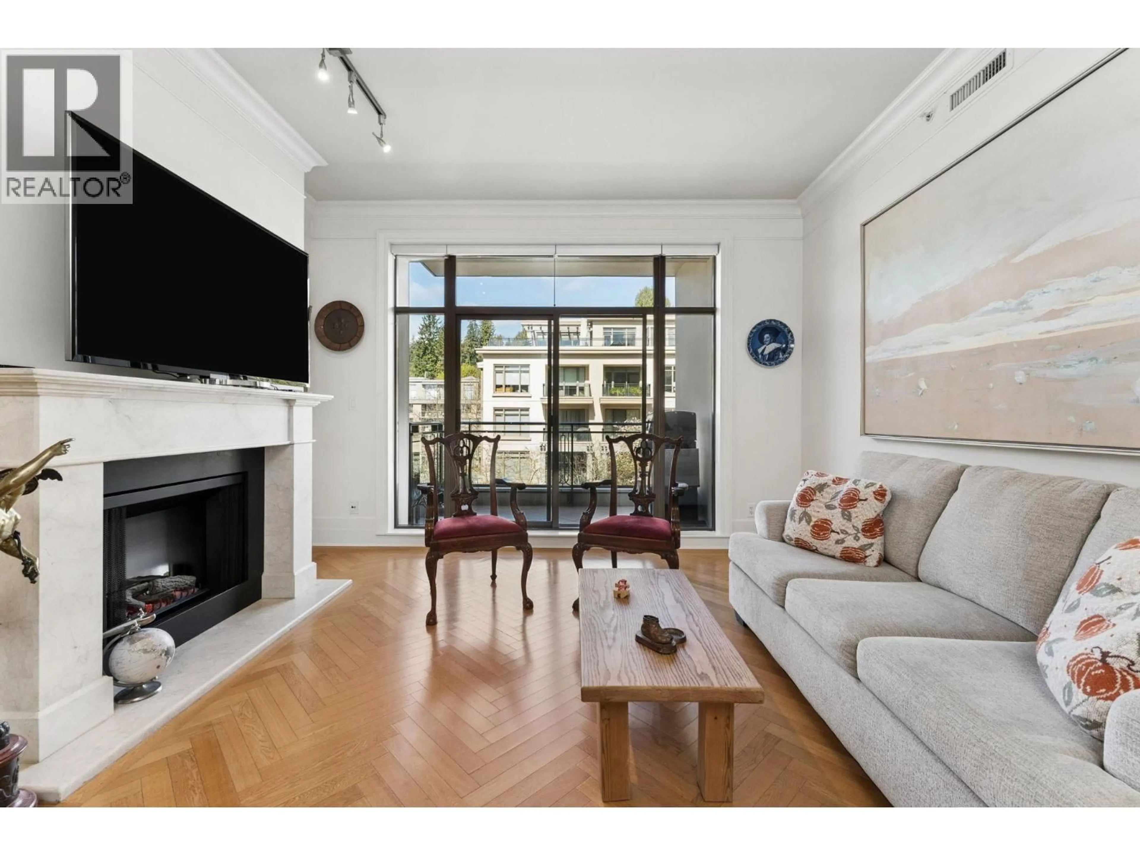 Living room with furniture, wood/laminate floor for 300 - 568 WATERS EDGE CRESCENT, West Vancouver British Columbia V7T0A2