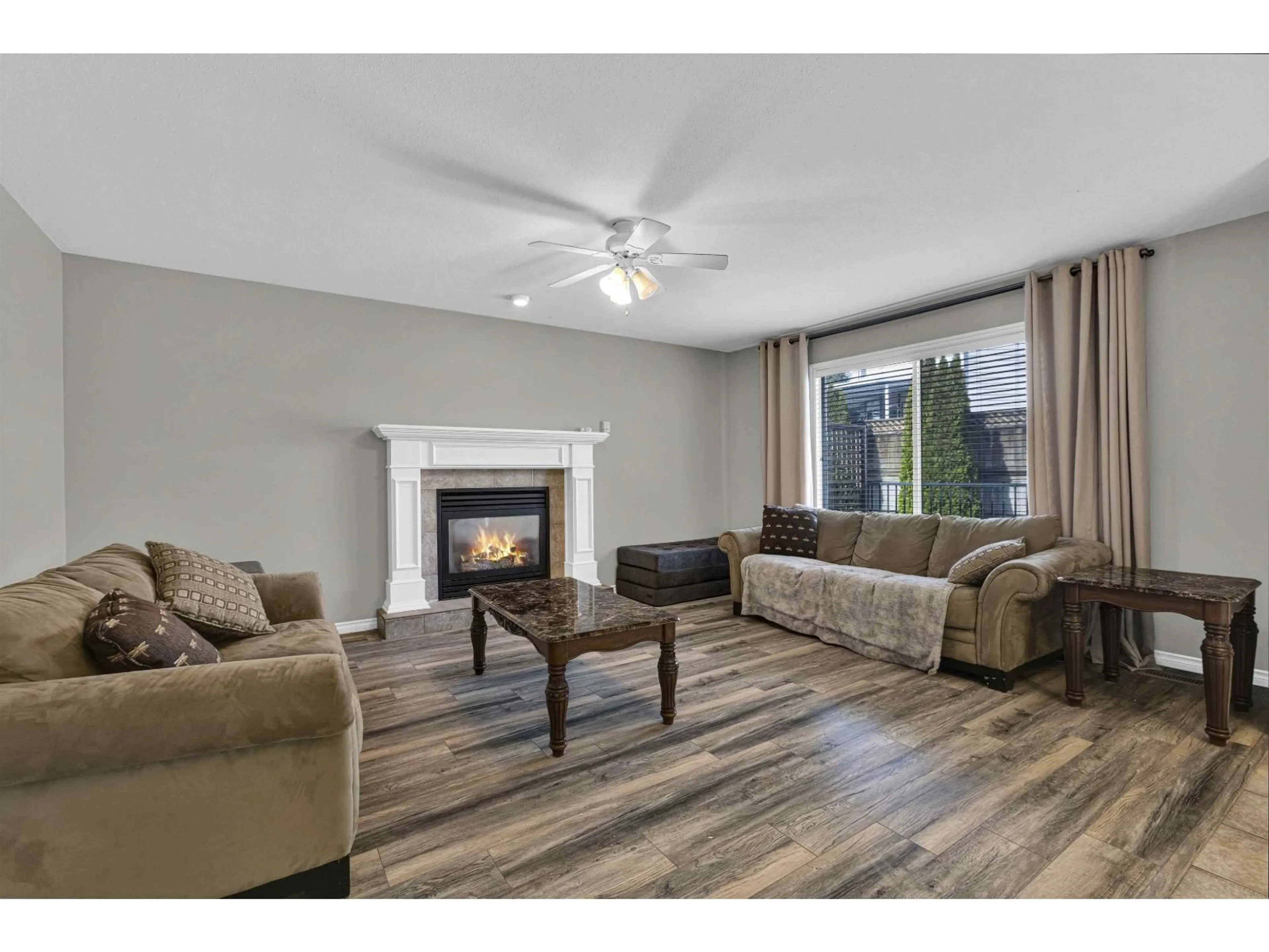 Living room with furniture, wood/laminate floor for 5359 TESKEY ROAD, Sardis British Columbia V2R5M9