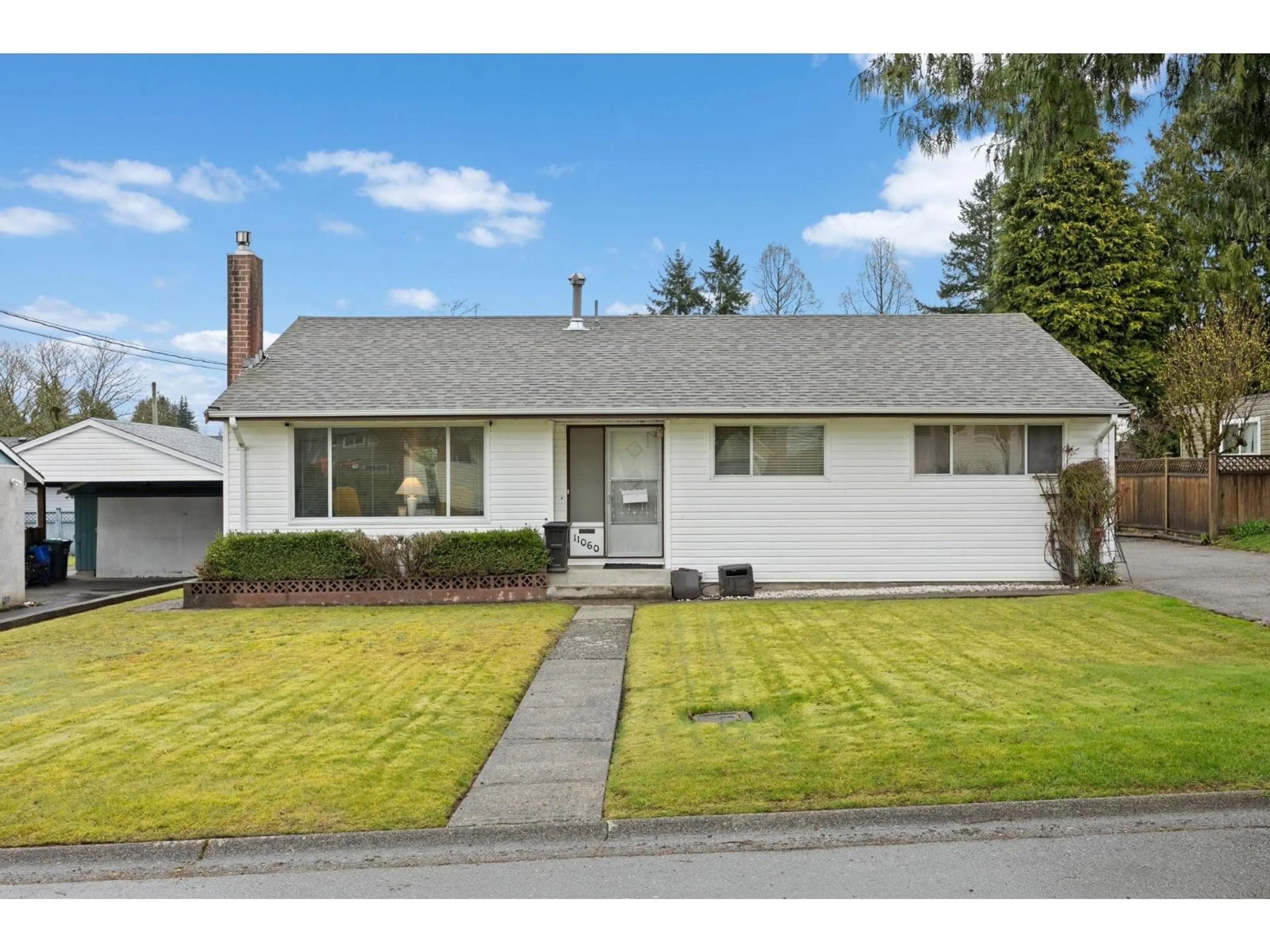 Home with vinyl exterior material, street for 11060 WREN CRESCENT, Surrey British Columbia V3R5A2