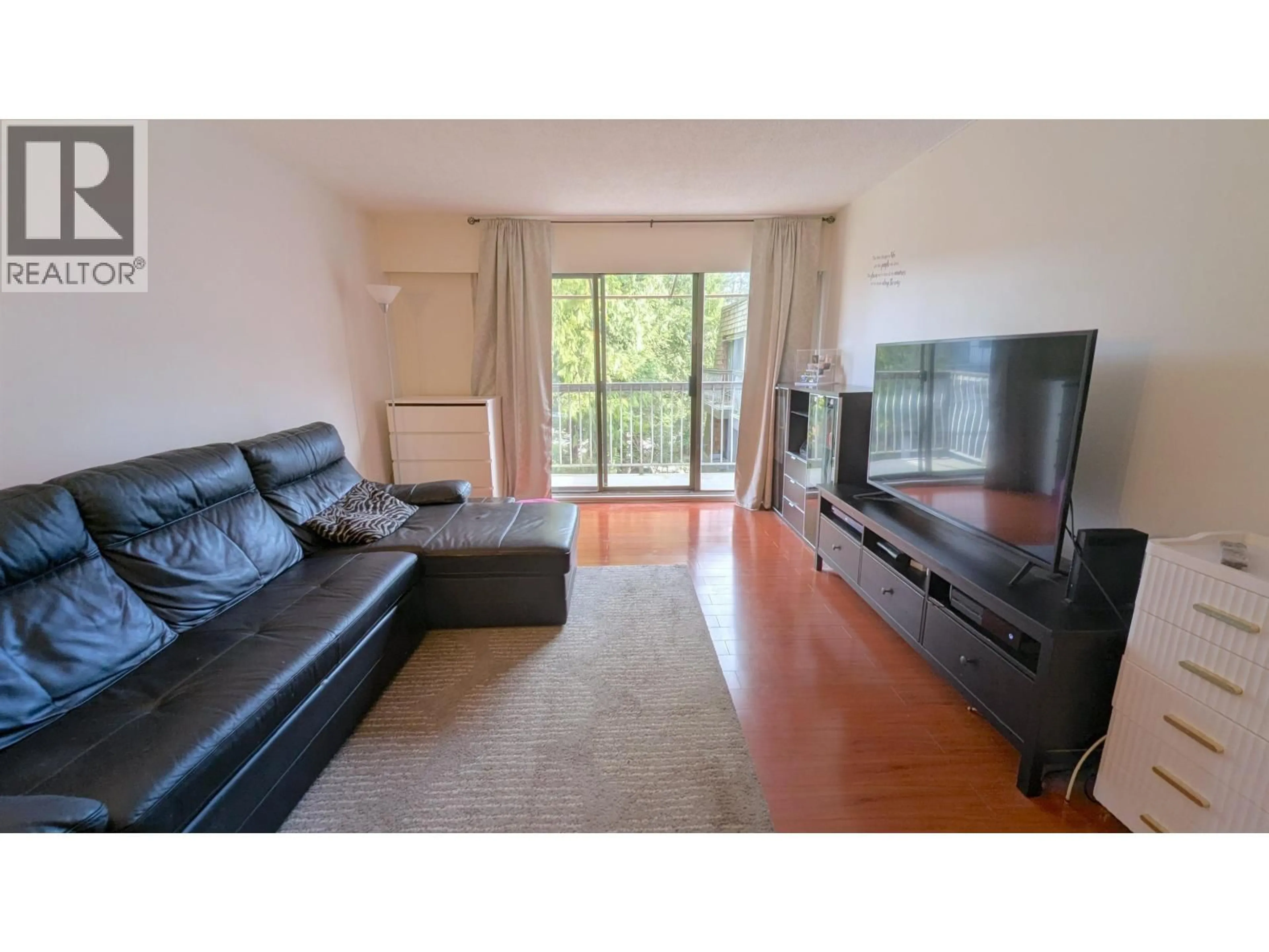 Living room with furniture, wood/laminate floor for 308 - 7428 19TH AVENUE, Burnaby British Columbia V3N1E1