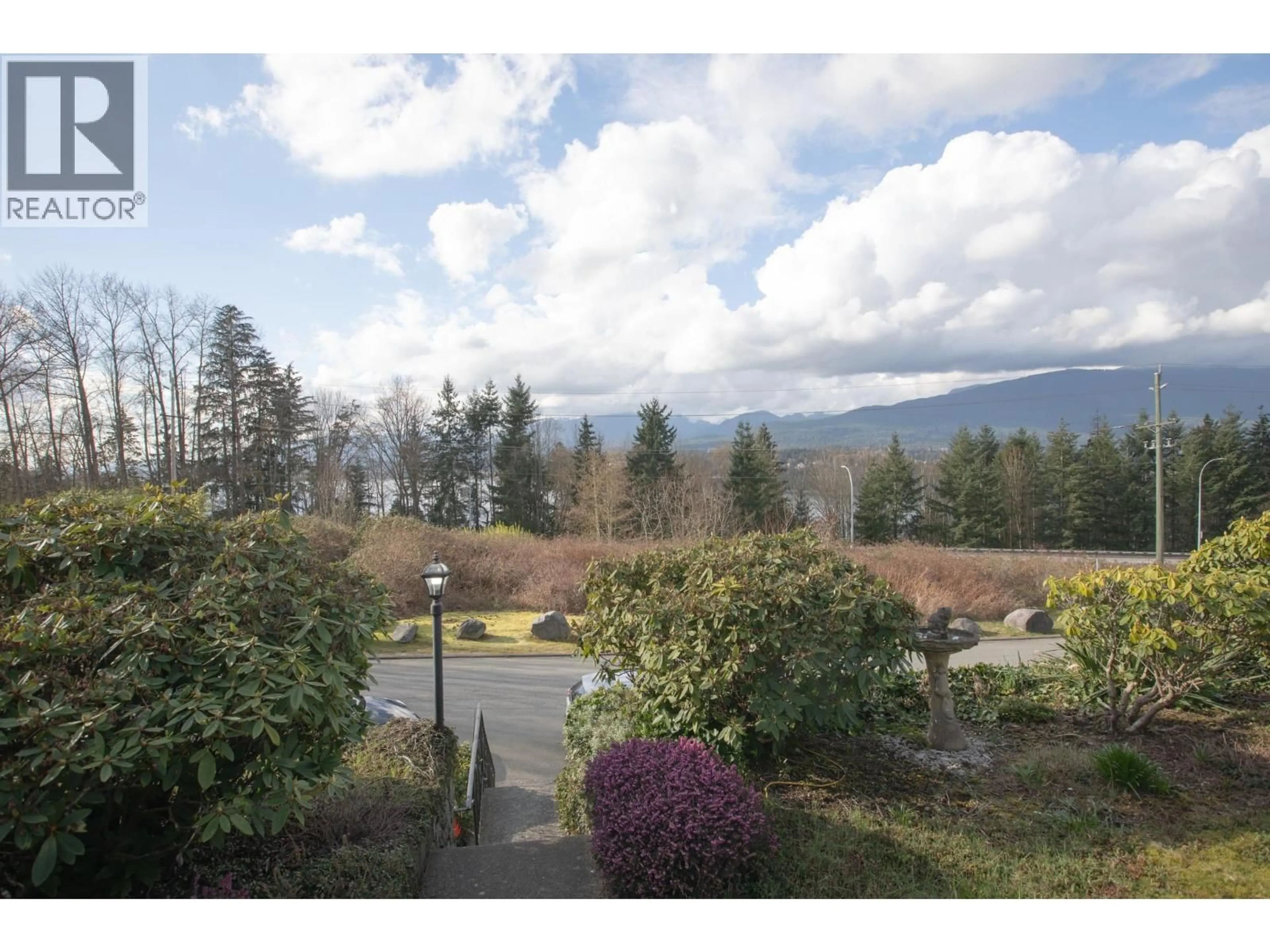 A pic from outside/outdoor area/front of a property/back of a property/a pic from drone, mountain view for 7352 BARNET ROAD, Burnaby British Columbia V5A1E4