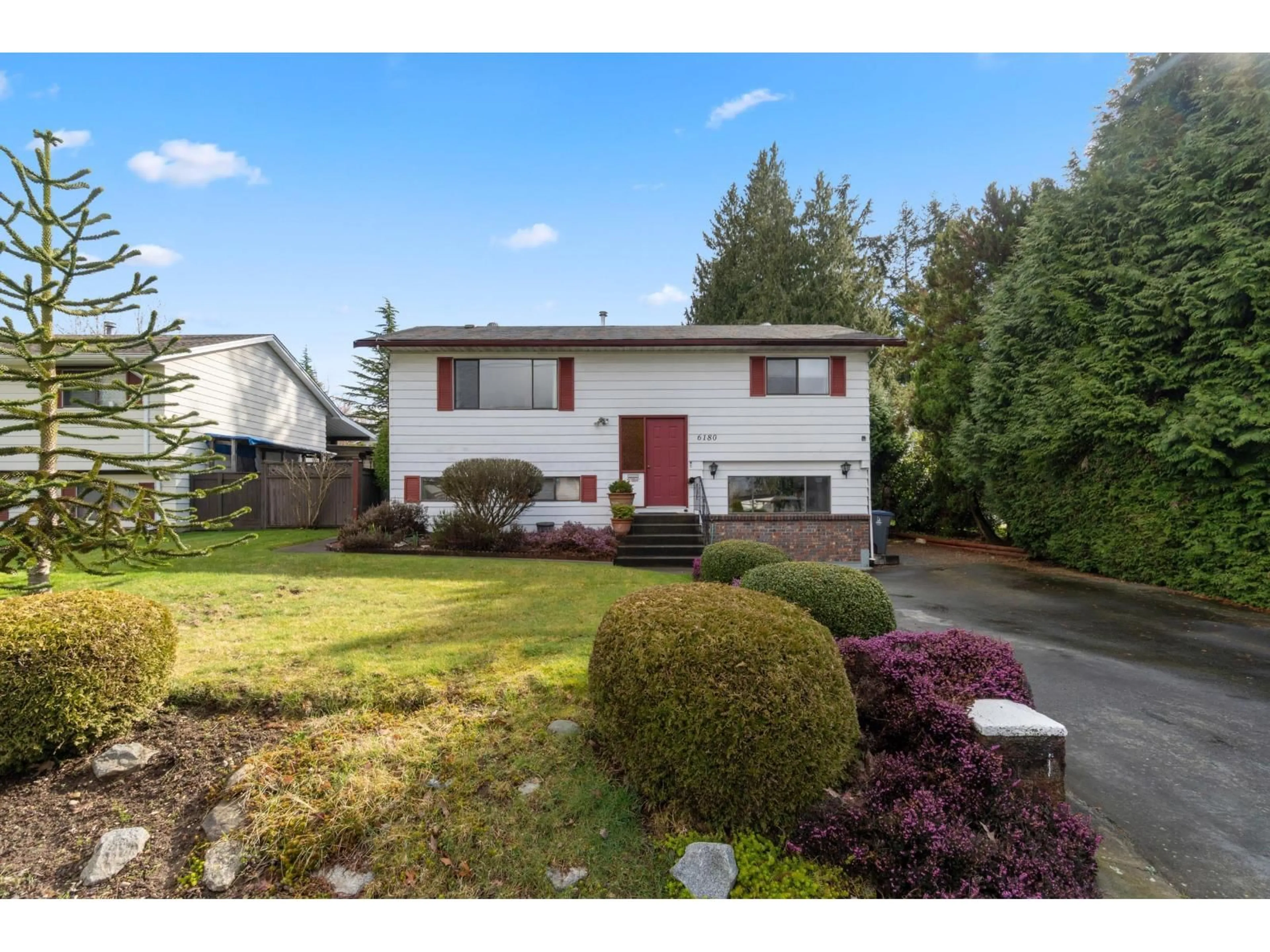 Home with vinyl exterior material, street for 6180 181A STREET, Surrey British Columbia V3S4M2