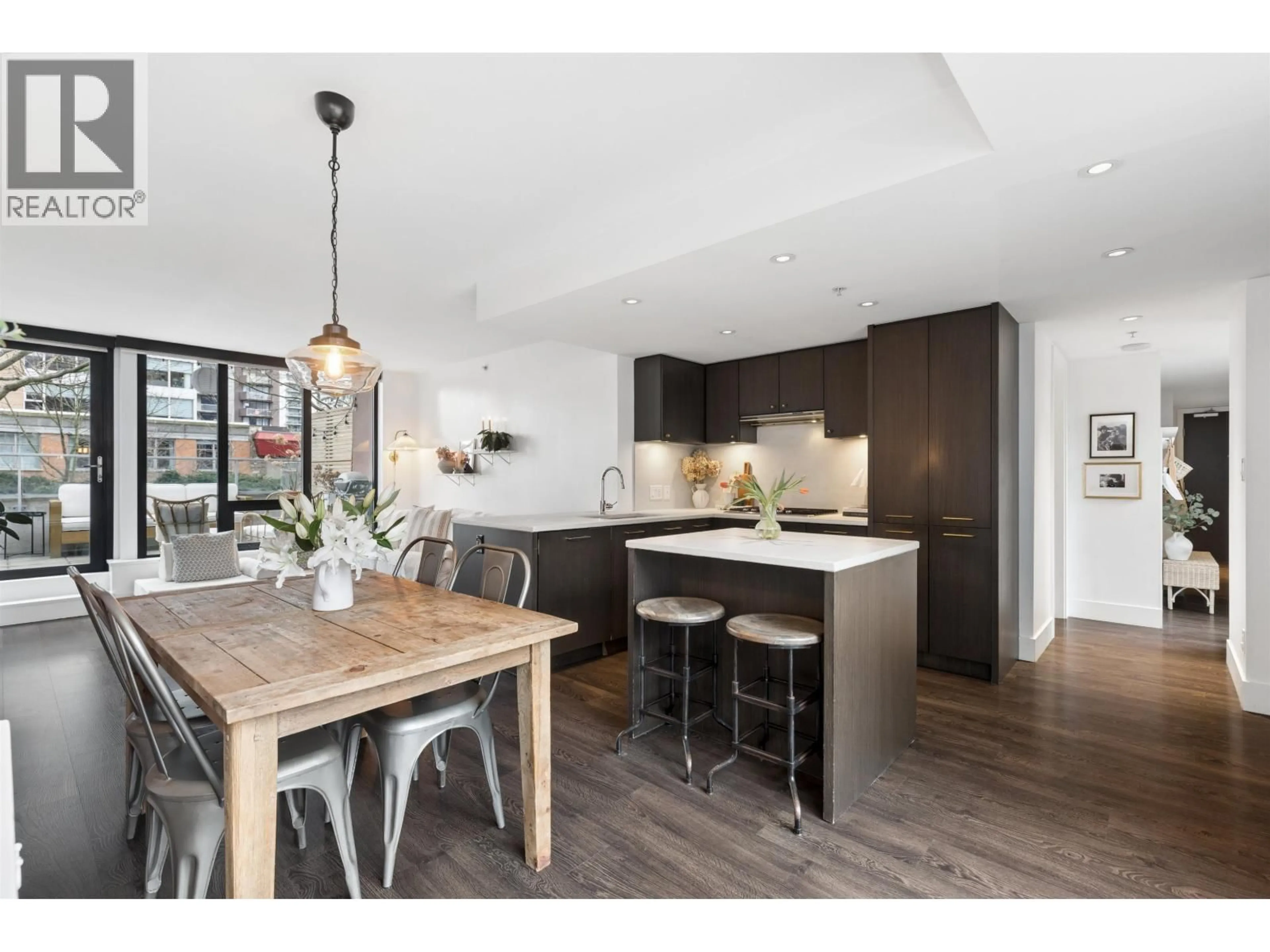 Open concept kitchen, wood/laminate floor for 303 - 150 15TH STREET, North Vancouver British Columbia V7M1R5