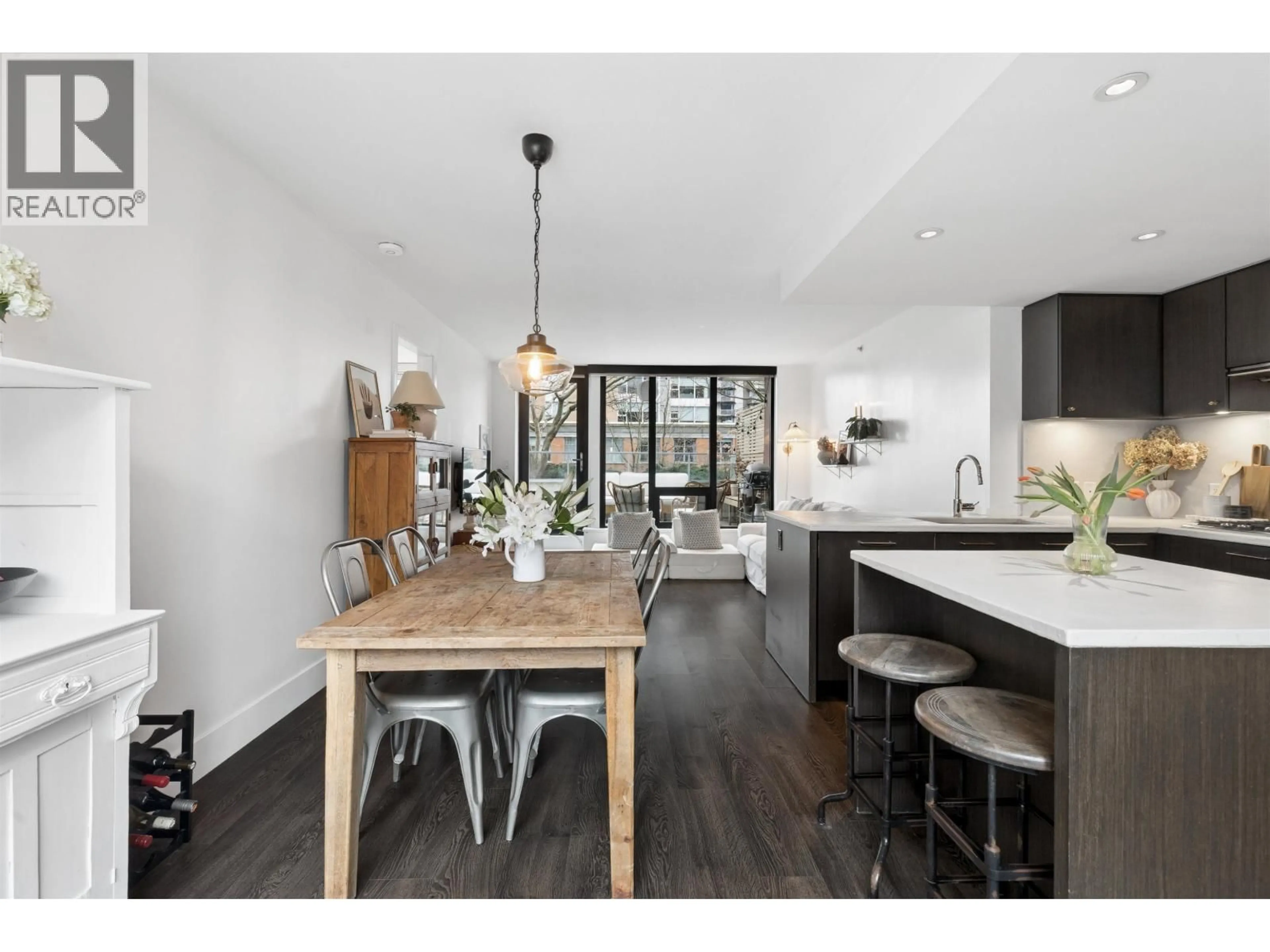 Open concept kitchen, wood/laminate floor for 303 - 150 15TH STREET, North Vancouver British Columbia V7M1R5