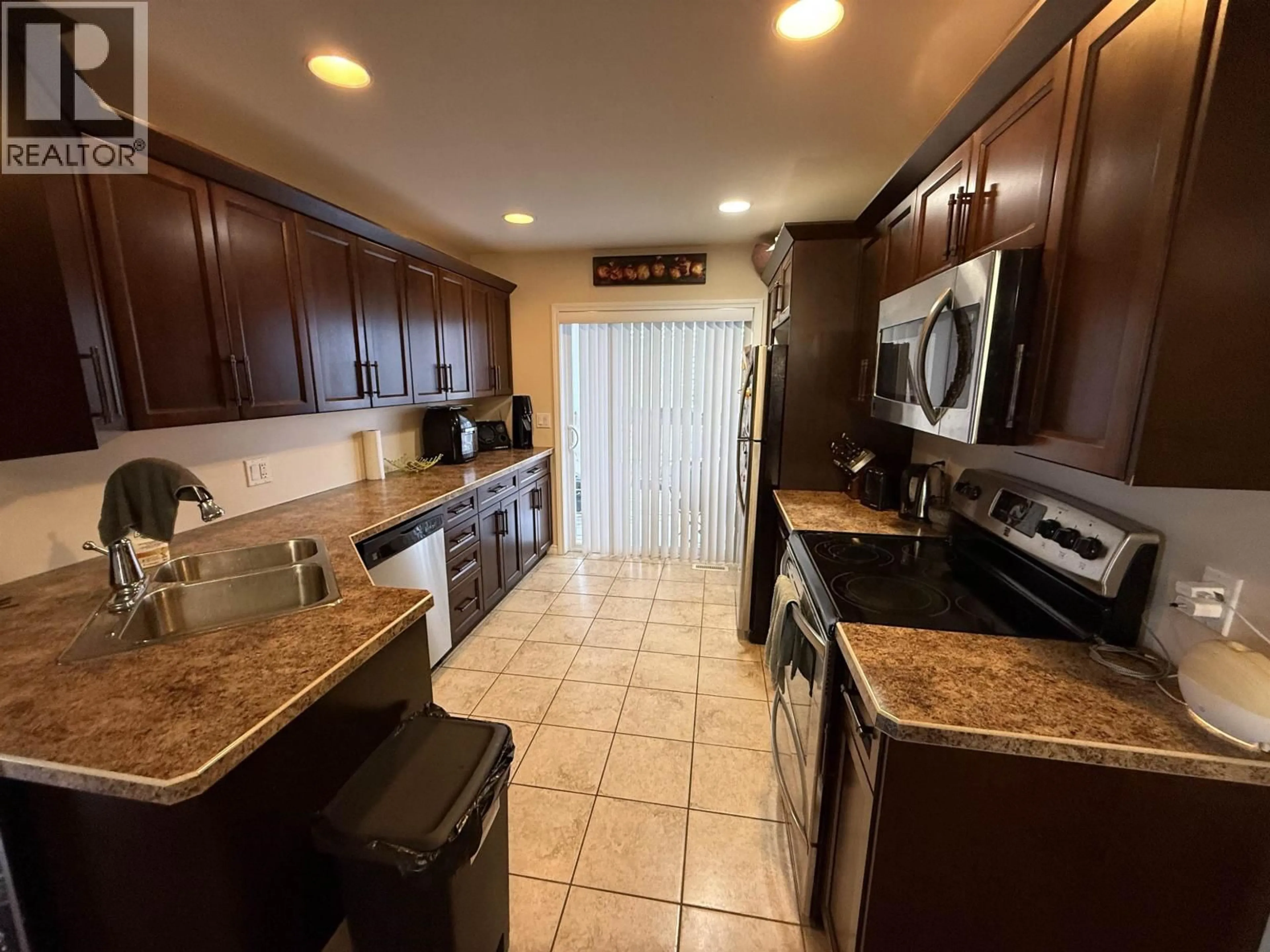 Standard kitchen, ceramic/tile floor for 8316 86 AVENUE, Fort St. John British Columbia V1J0G7