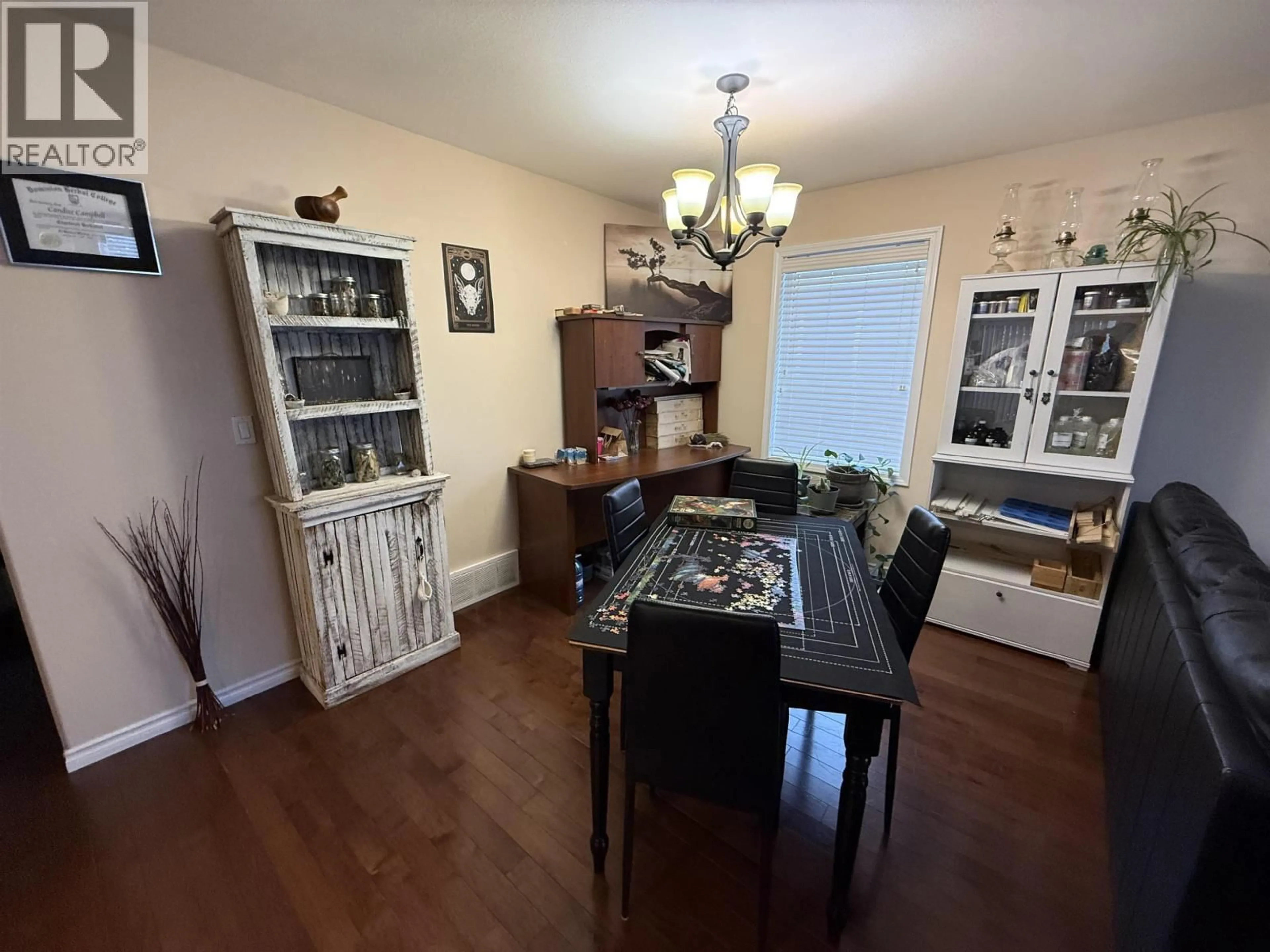 Dining room, wood/laminate floor for 8316 86 AVENUE, Fort St. John British Columbia V1J0G7