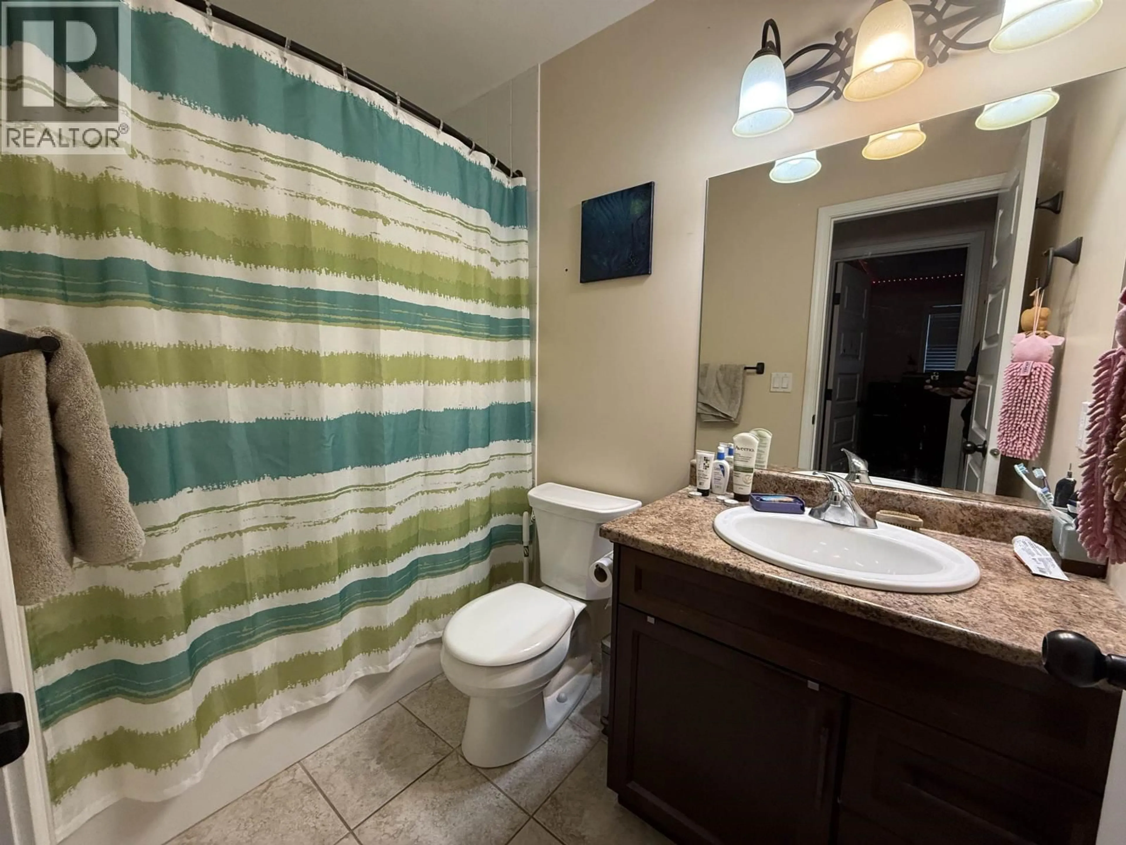 Standard bathroom, ceramic/tile floor for 8316 86 AVENUE, Fort St. John British Columbia V1J0G7