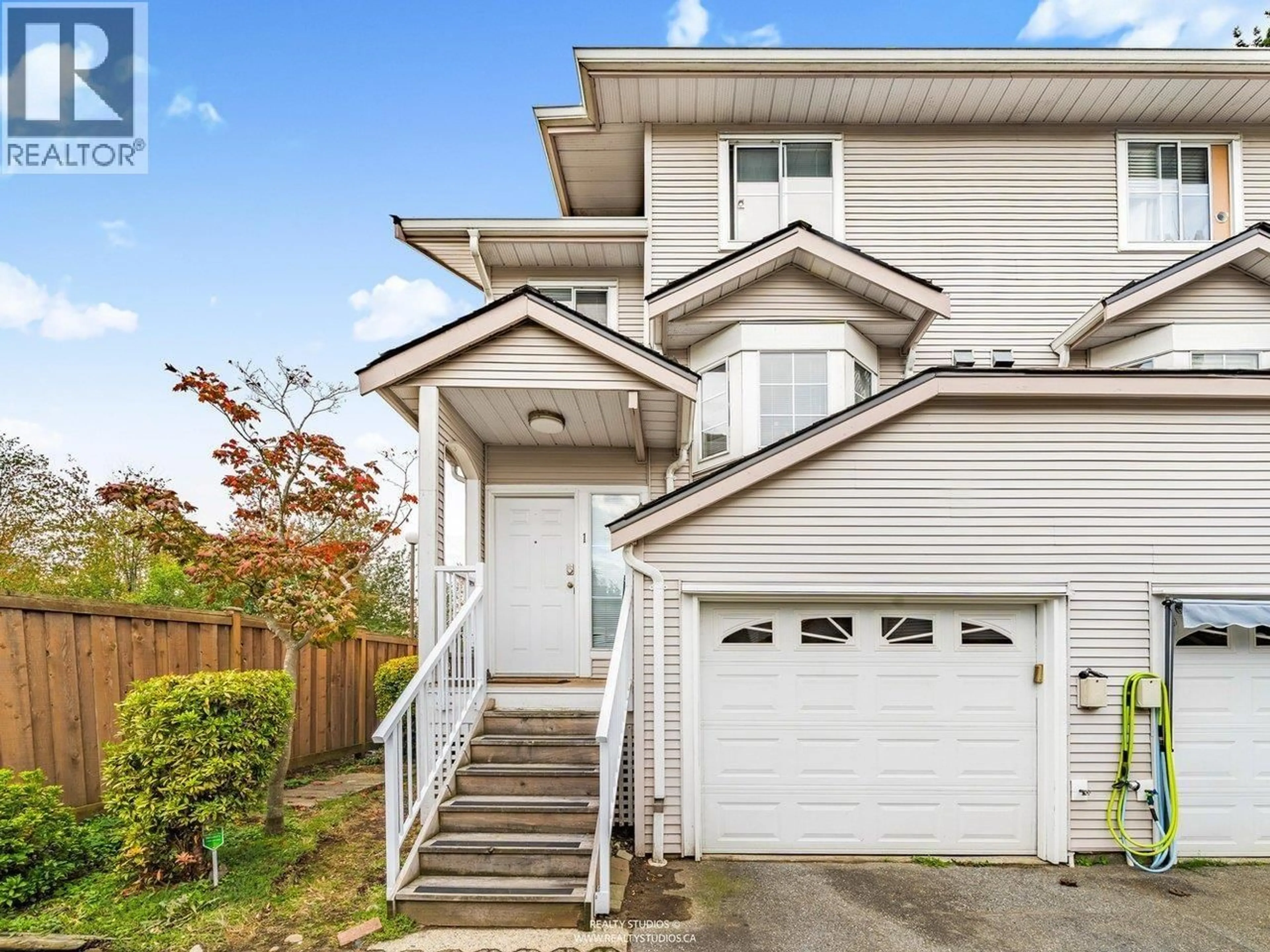Home with vinyl exterior material, street for 1 - 12188 HARRIS ROAD, Pitt Meadows British Columbia V3Y2N3
