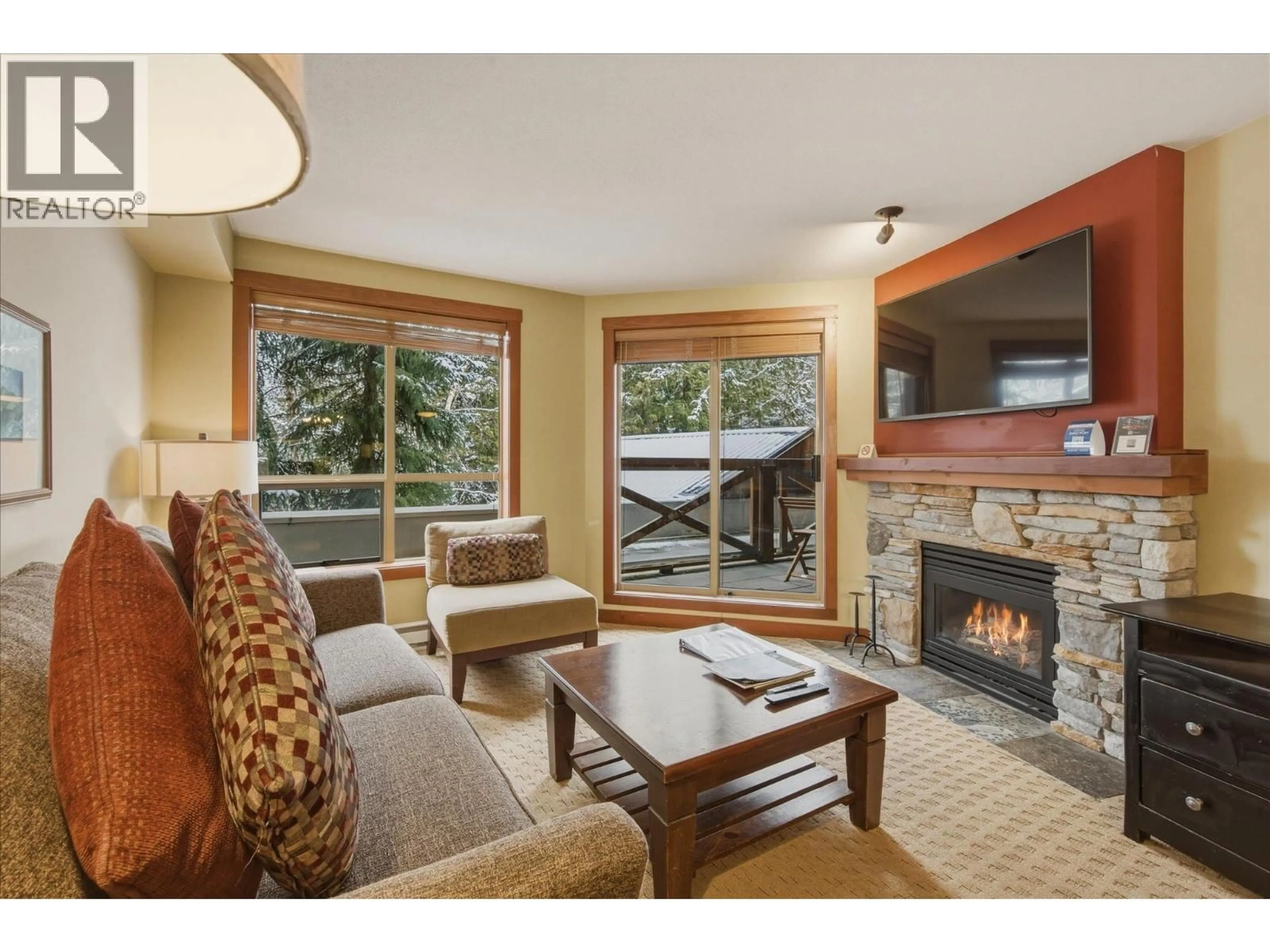 Living room with furniture, wood/laminate floor for 202(G1) - 4653 BLACKCOMB WAY, Whistler British Columbia V8E0Y9