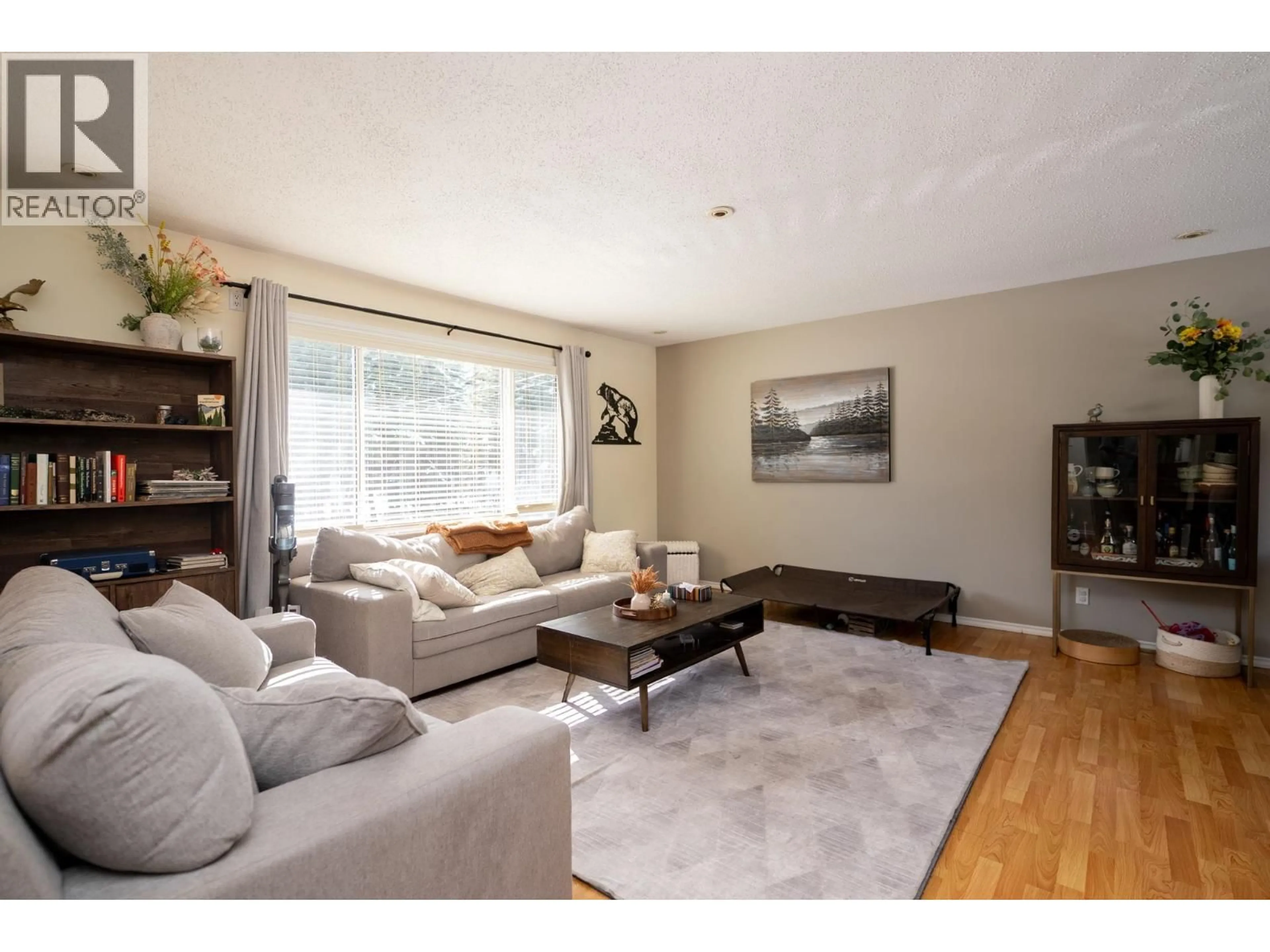 Living room with furniture, wood/laminate floor for 13280 BERGMAN ROAD, Miworth British Columbia V2M7C2