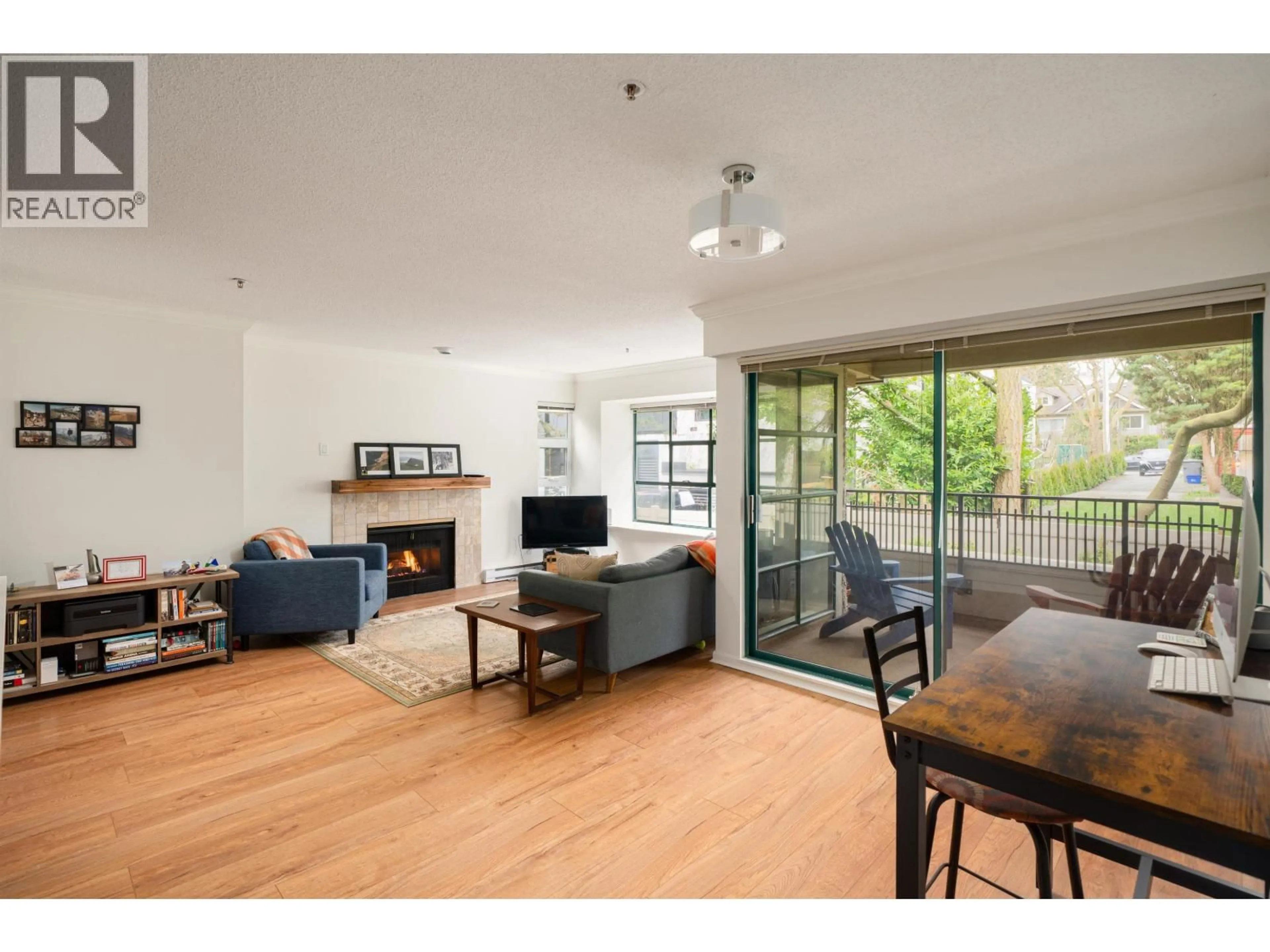 Living room with furniture, wood/laminate floor for 205 - 3788 8TH AVENUE, Vancouver British Columbia V6R1Z3