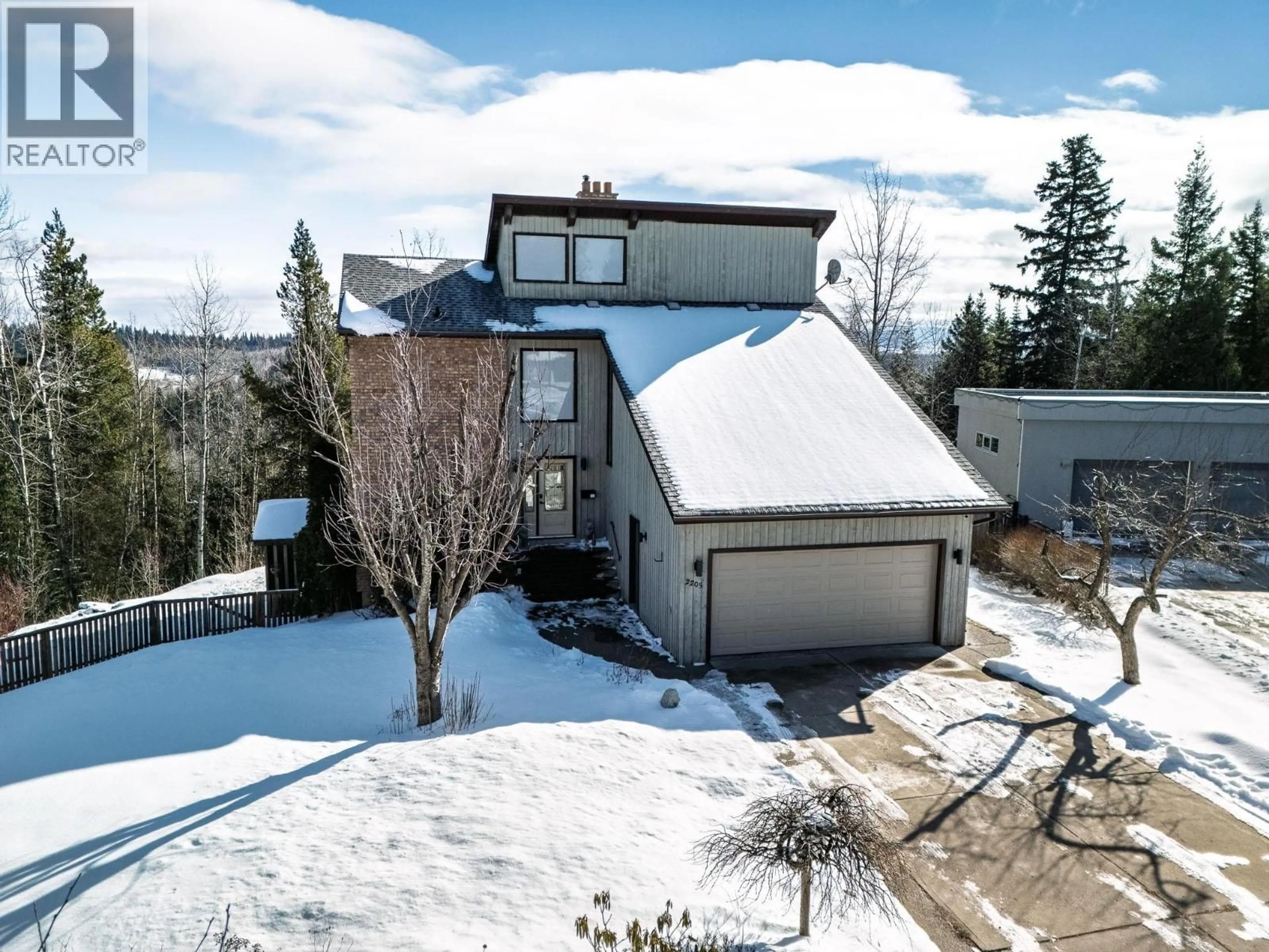 A pic from outside/outdoor area/front of a property/back of a property/a pic from drone, mountain view for 2205 CARLISLE PLACE, Prince George British Columbia V2K4B8