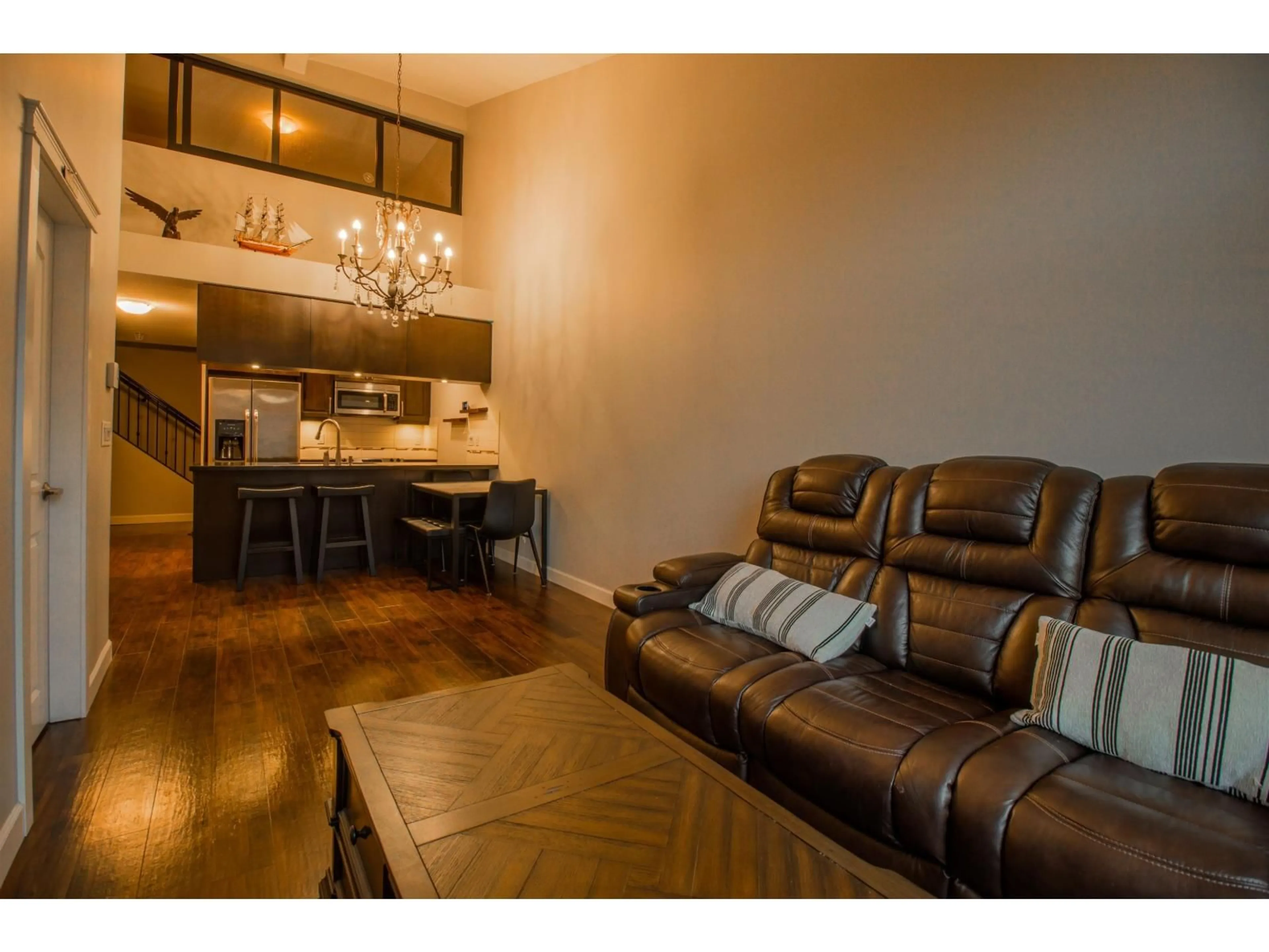 Living room with furniture, wood/laminate floor for 407 - 8328 207A STREET, Langley British Columbia V2Y0K5