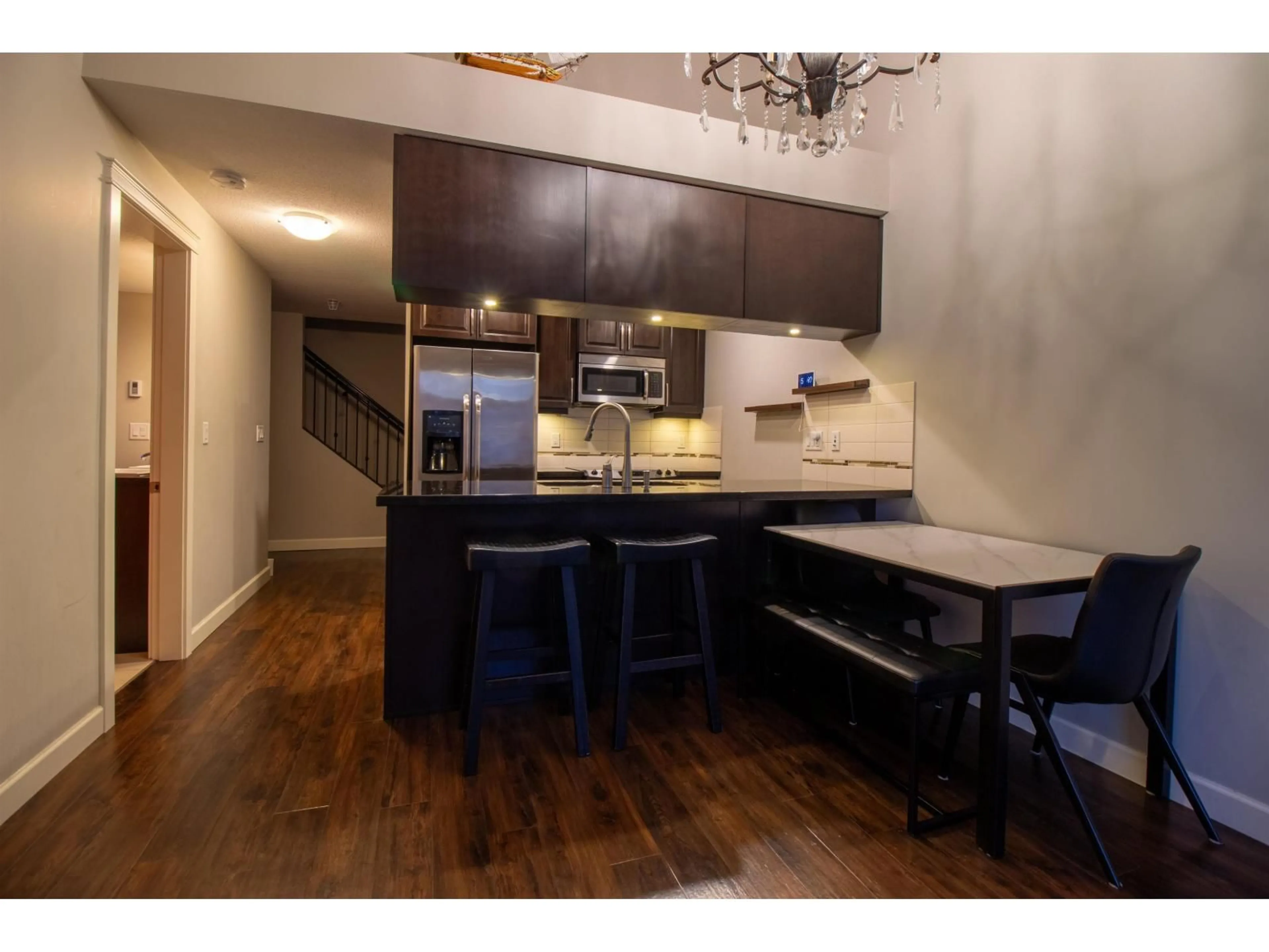 Open concept kitchen, wood/laminate floor for 407 - 8328 207A STREET, Langley British Columbia V2Y0K5