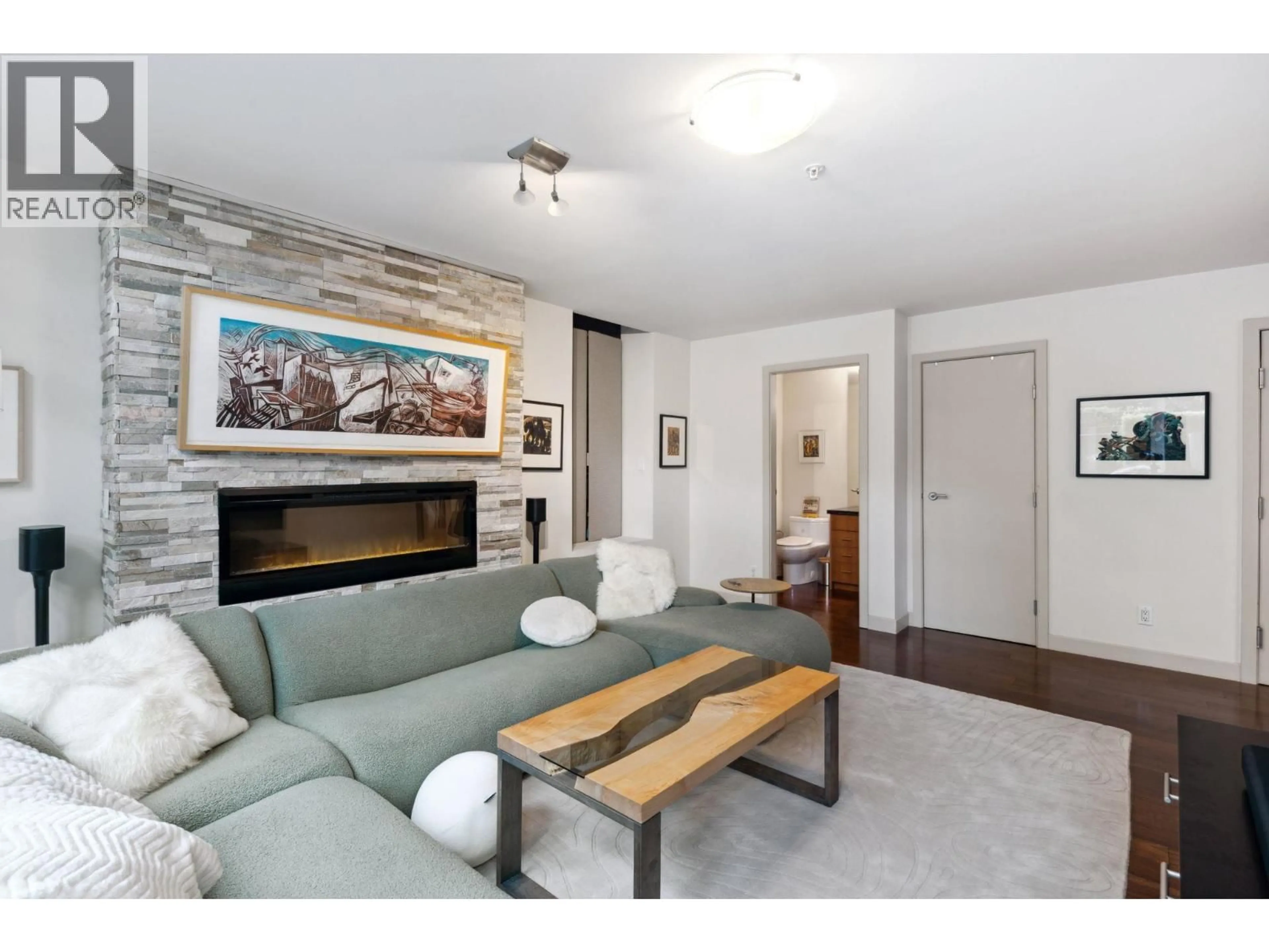 Living room with furniture, wood/laminate floor for TH12 - 1233 CORDOVA STREET, Vancouver British Columbia V6C3R1