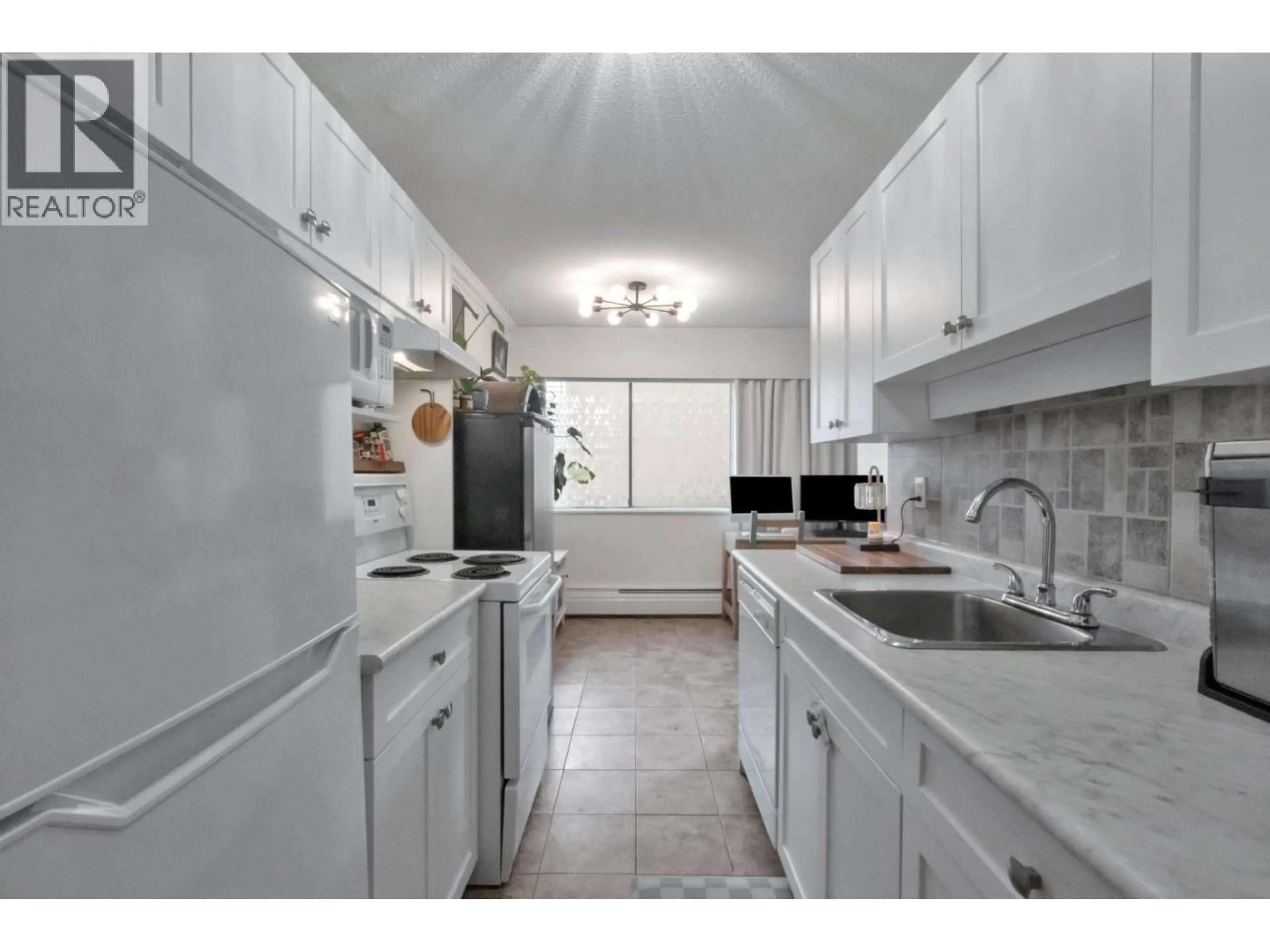 Standard kitchen, ceramic/tile floor for 103 - 214 15TH STREET, North Vancouver British Columbia V7L2R3