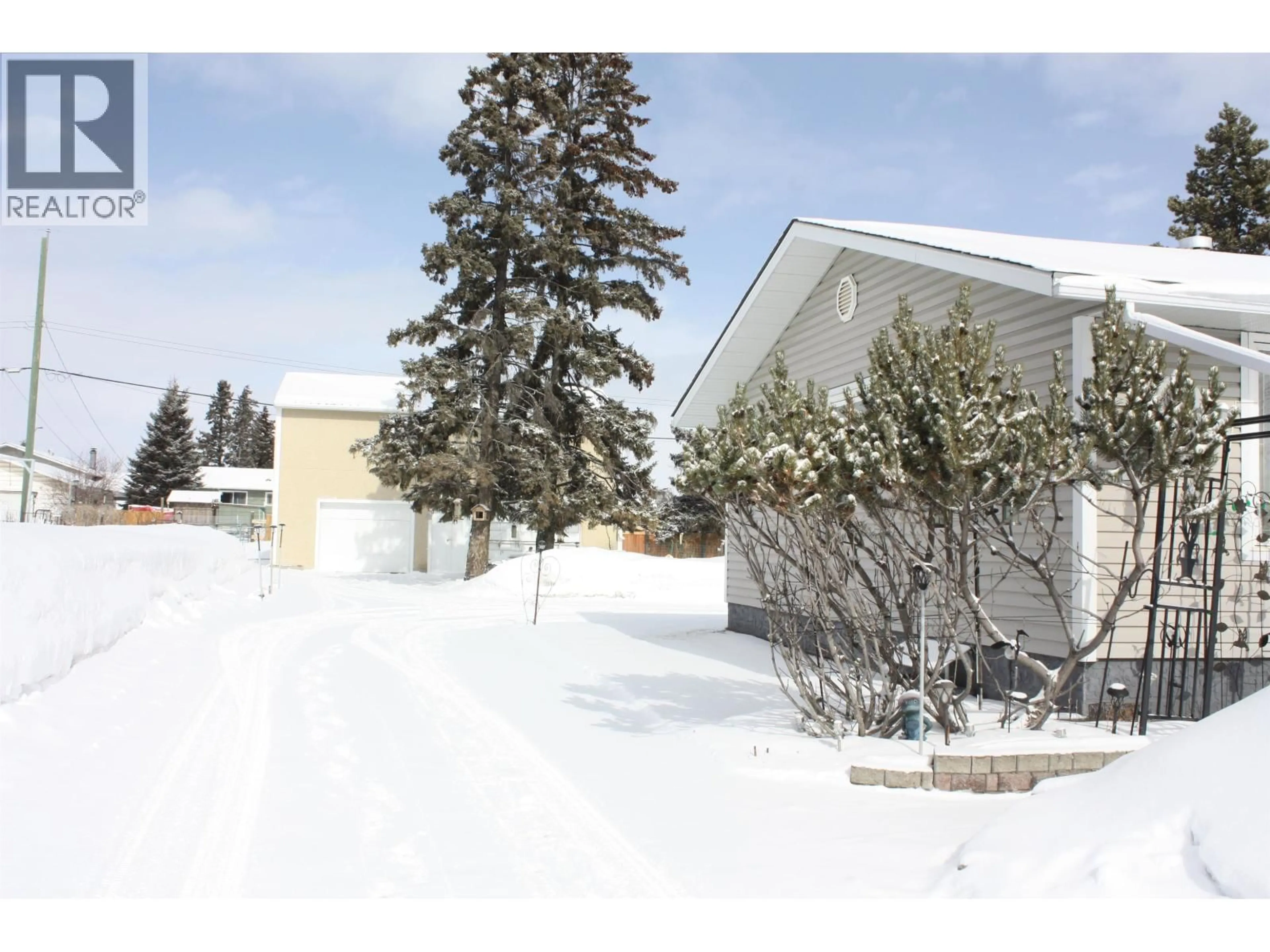 A pic from outside/outdoor area/front of a property/back of a property/a pic from drone, street for 8116 95 AVENUE, Fort St. John British Columbia V1J1G8