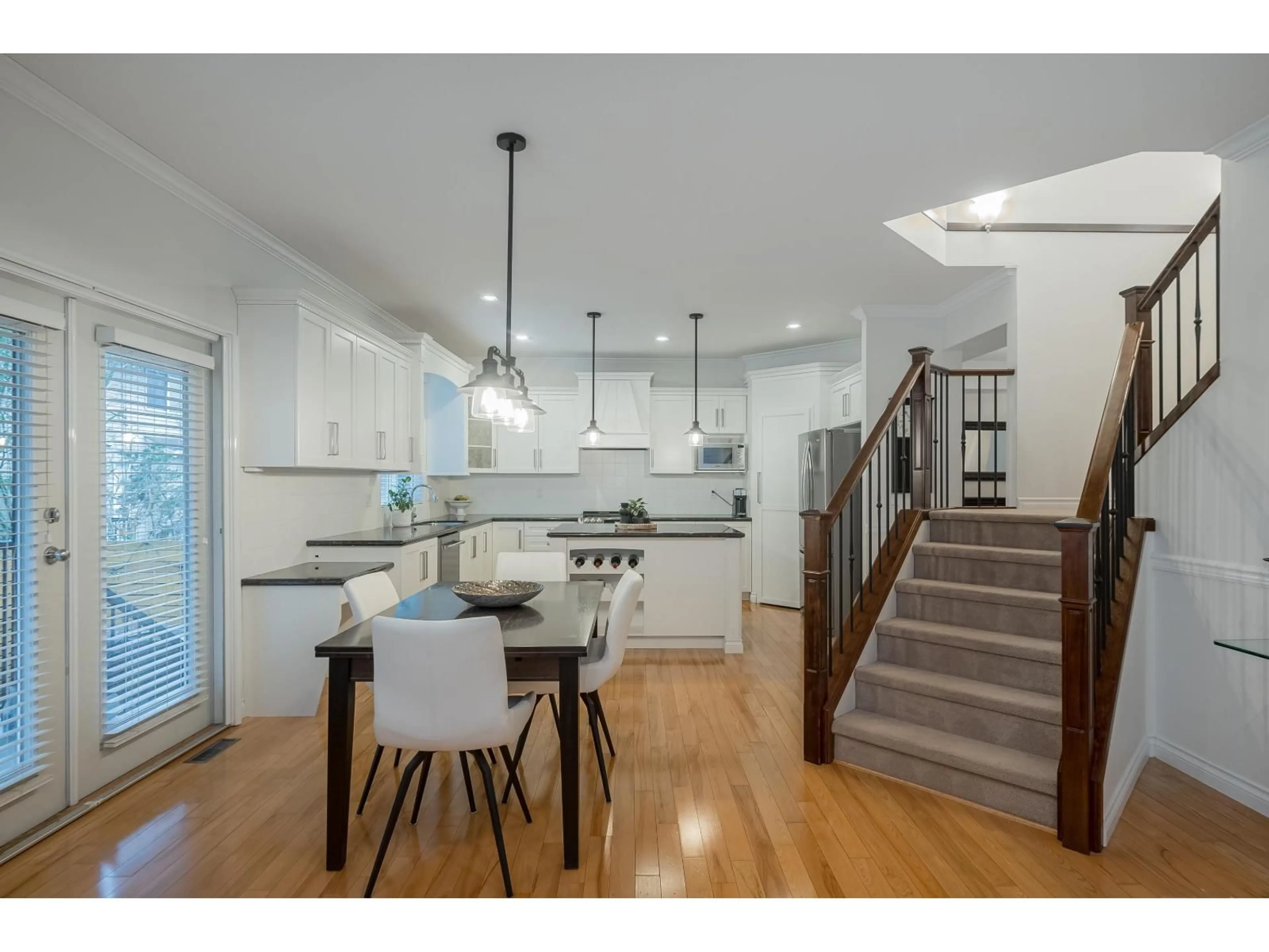 Open concept kitchen, wood/laminate floor for 21650 91 AVENUE, Langley British Columbia V1M4C9