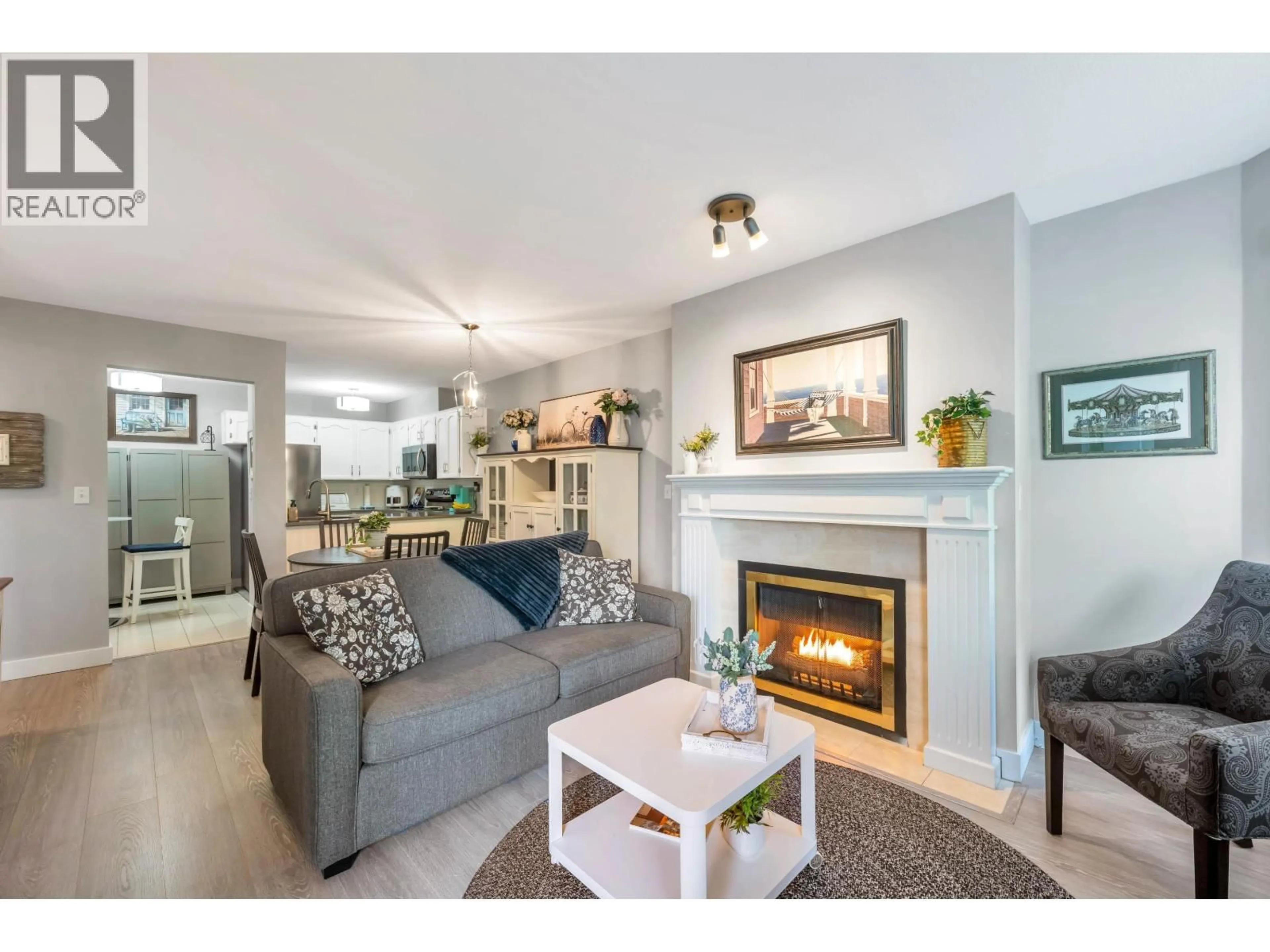 Living room with furniture, wood/laminate floor for D205 - 4845 53 STREET, Delta British Columbia V4K2Z3