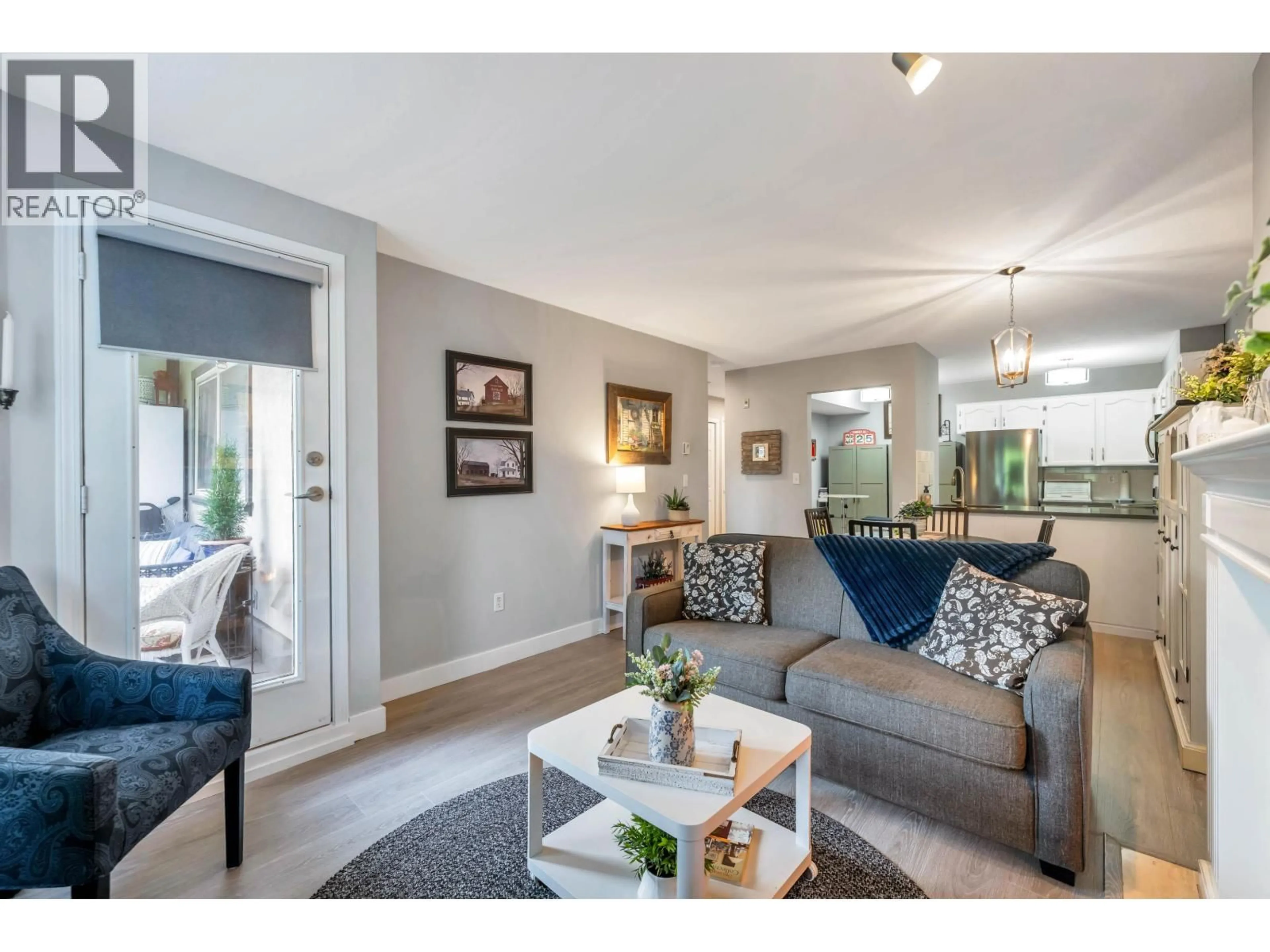 Living room with furniture, wood/laminate floor for D205 - 4845 53 STREET, Delta British Columbia V4K2Z3