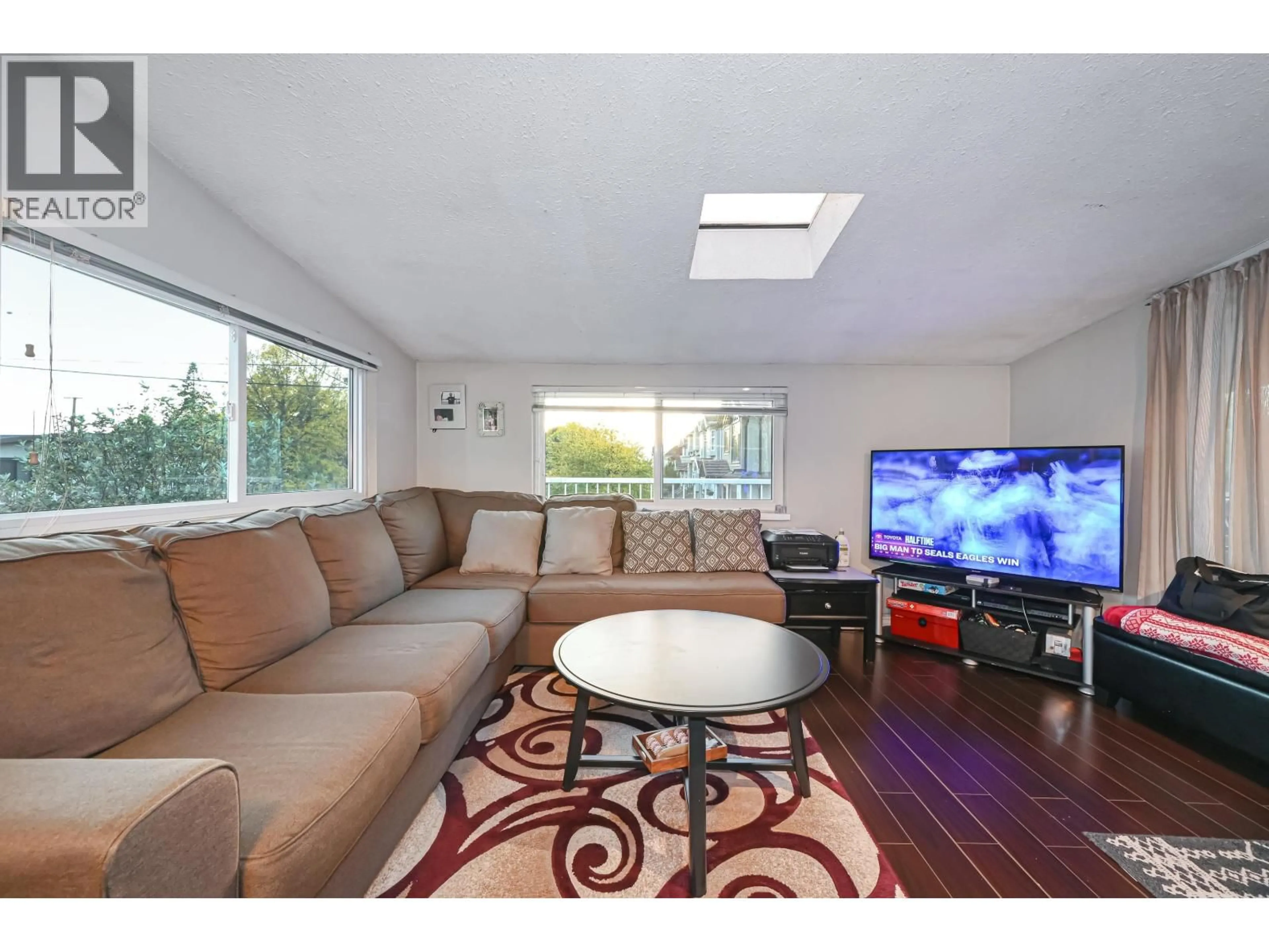 Living room with furniture, wood/laminate floor for 2295 48TH AVENUE, Vancouver British Columbia V5P1R9