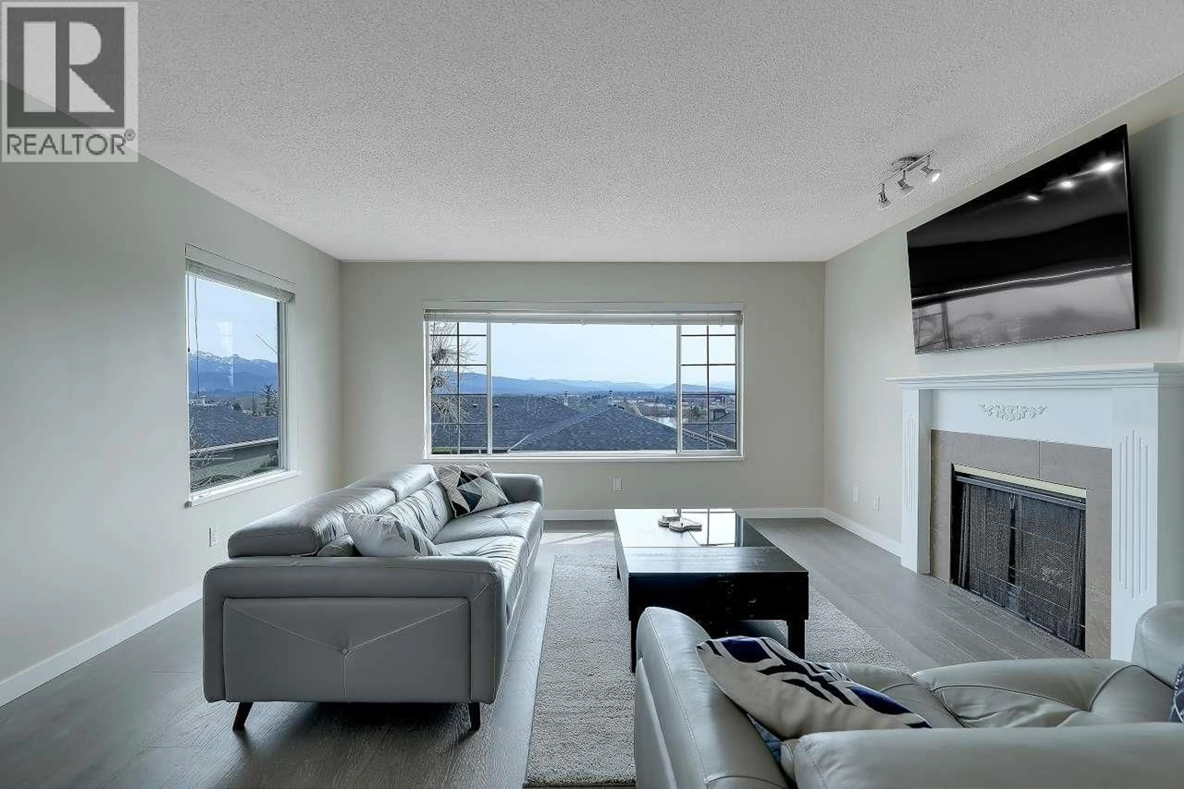 Living room with furniture, unknown for 208 - 1140 CASTLE CRESCENT, Port Coquitlam British Columbia V3C5R6