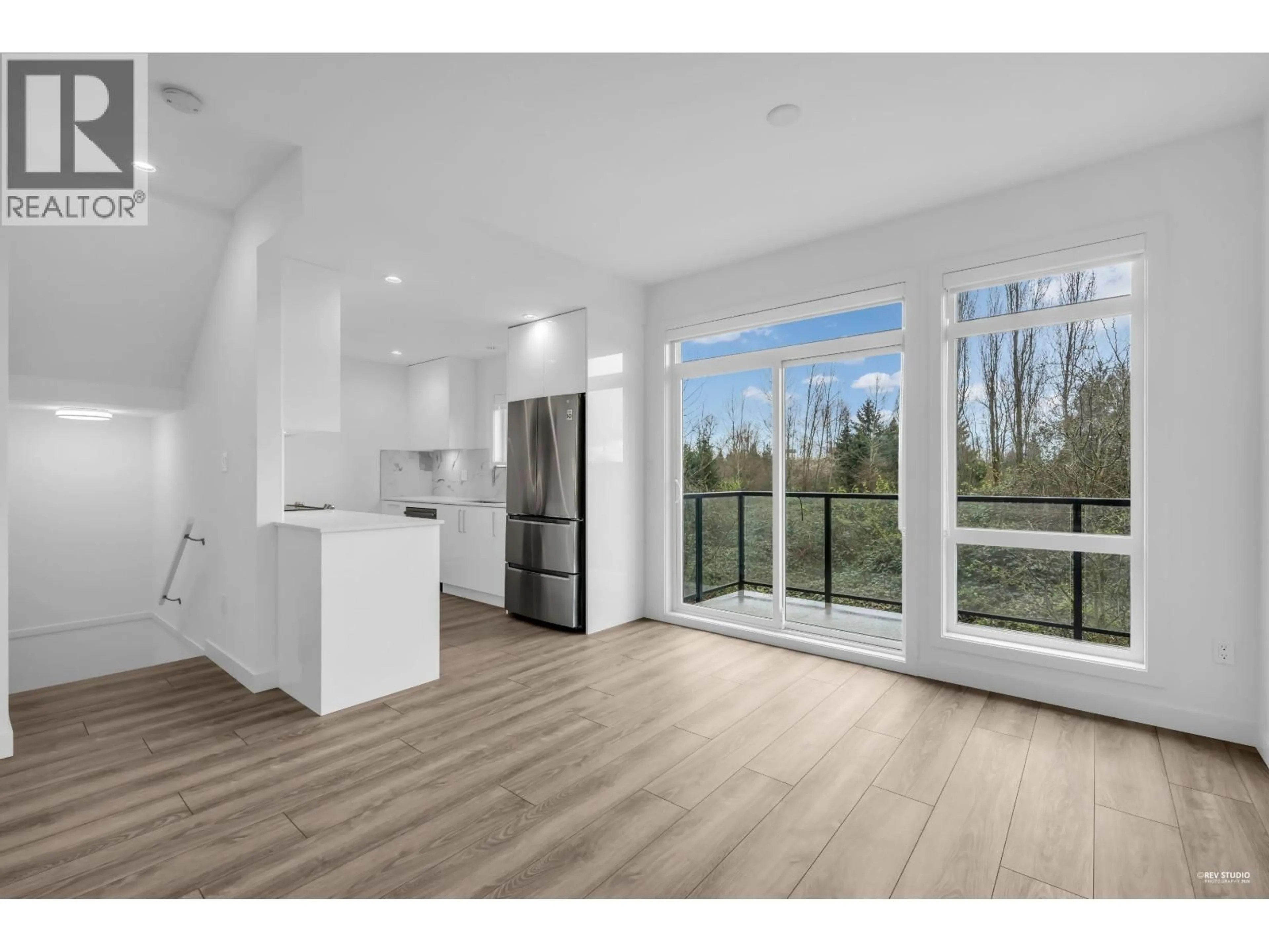 Open concept kitchen, wood/laminate floor for 7 - 4300 THOMPSON ROAD, Richmond British Columbia V6V0C3