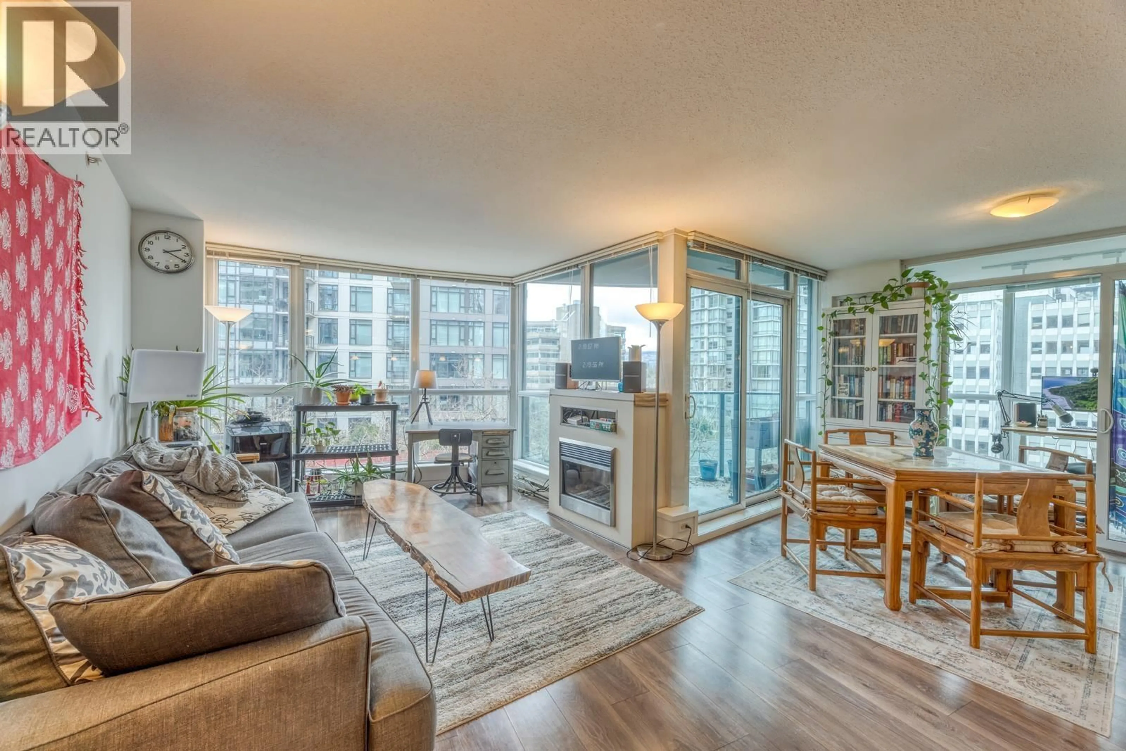 Living room with furniture, wood/laminate floor for 501 - 1189 MELVILLE STREET, Vancouver British Columbia V6E4T8