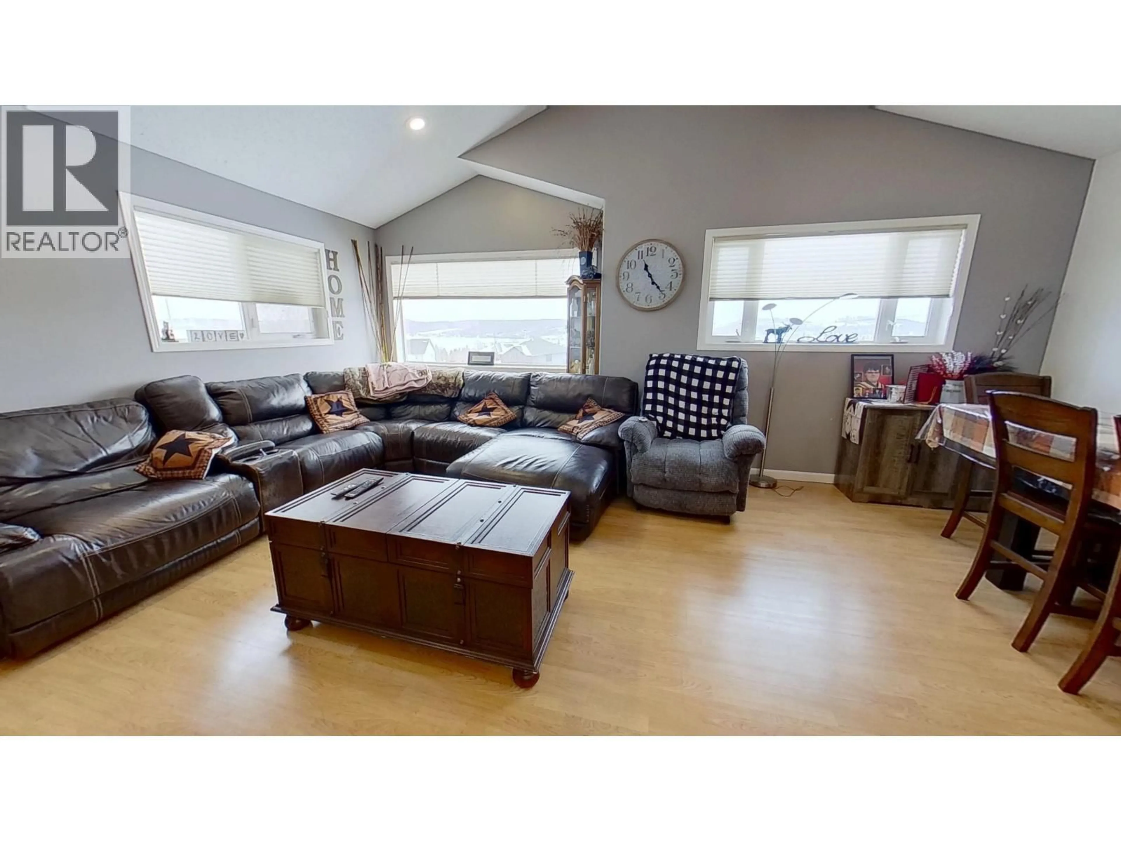 Living room with furniture, wood/laminate floor for 12851 BENS ROAD, Charlie Lake British Columbia V0C1H0