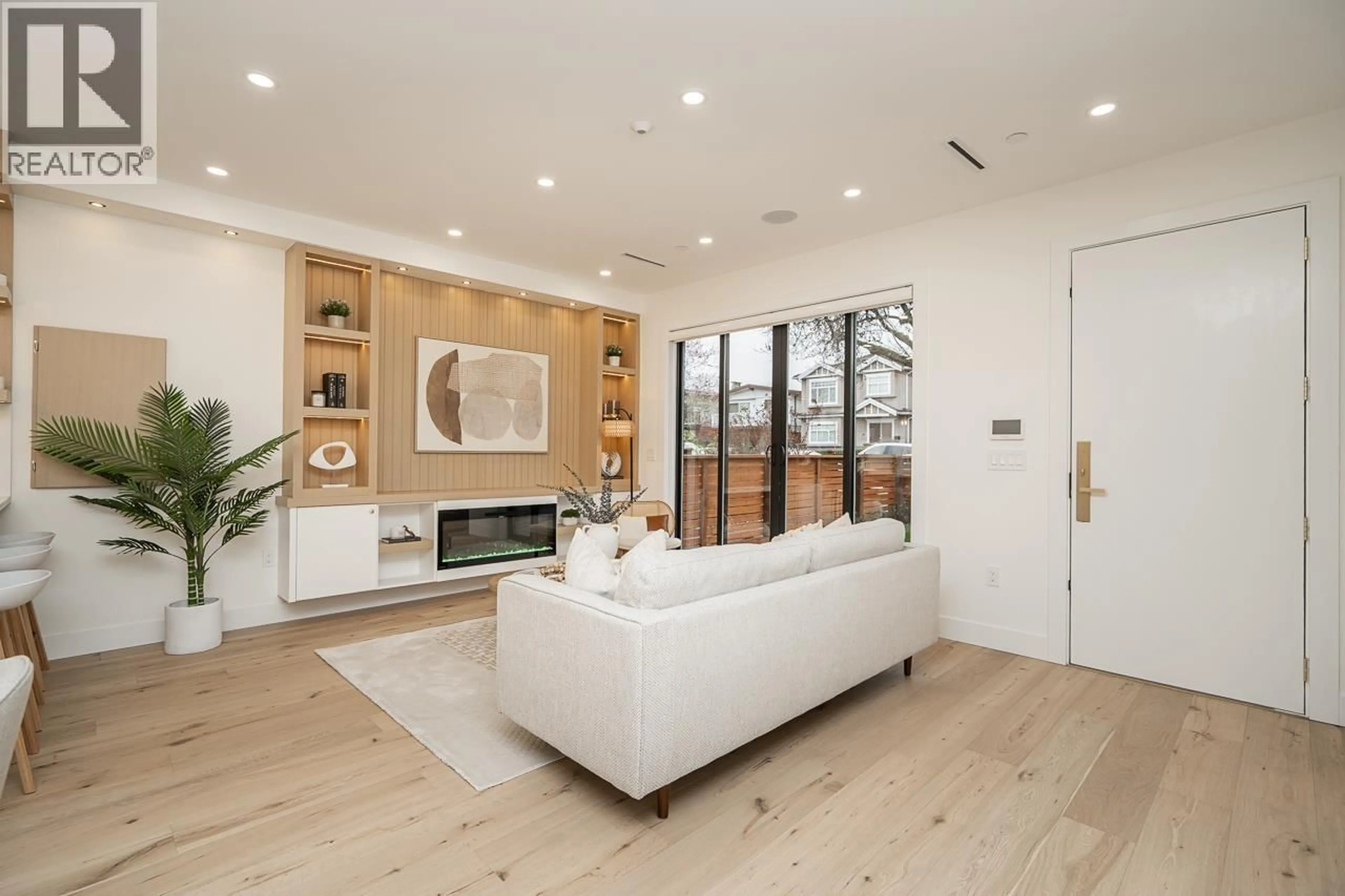 Living room with furniture, wood/laminate floor for 1 - 150 51ST AVENUE, Vancouver British Columbia V5X1C3