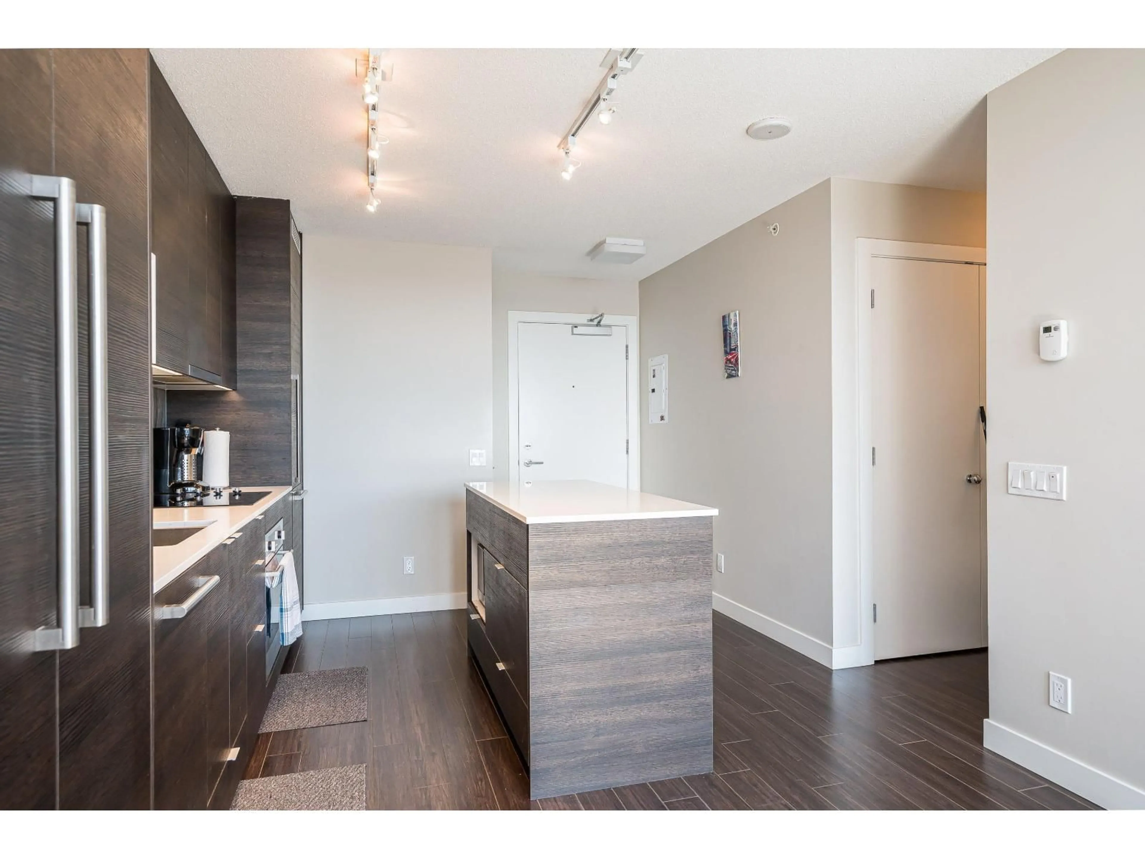 Open concept kitchen, wood/laminate floor for 1609 - 13398 104 AVENUE, Surrey British Columbia V3T1V6