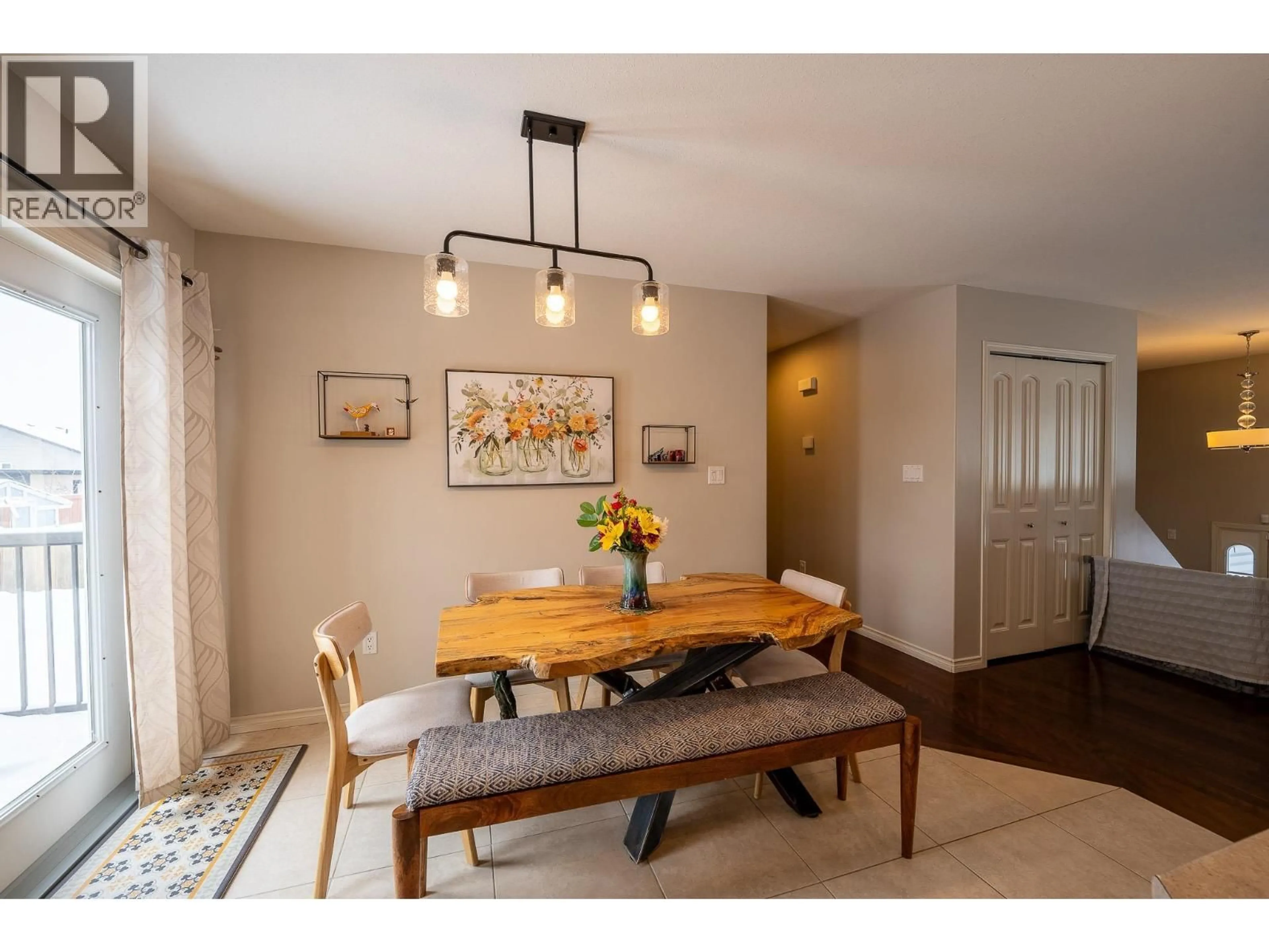 Dining room, wood/laminate floor for 8711 113A AVENUE, Fort St. John British Columbia V1J0C4