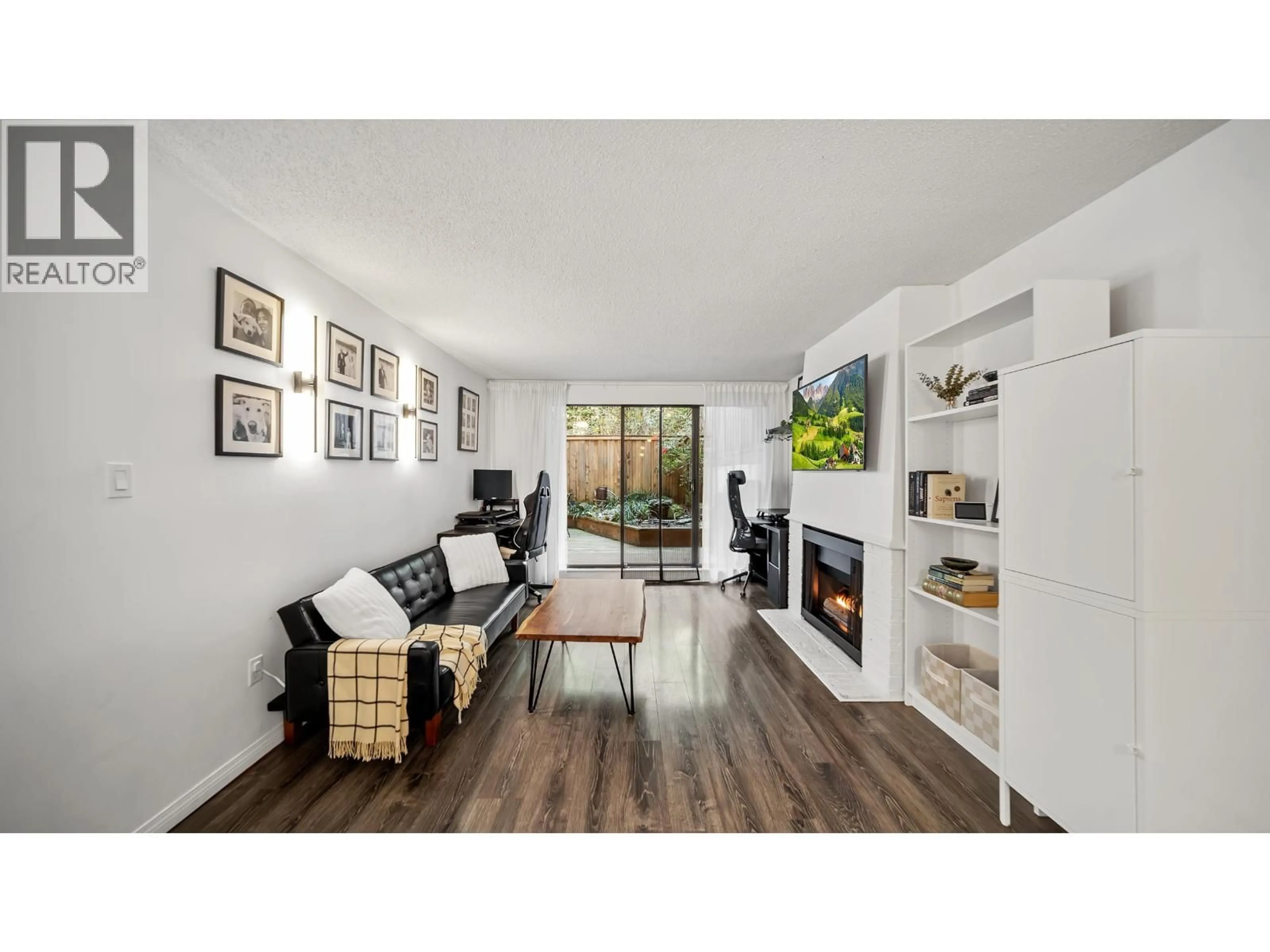 Living room with furniture, wood/laminate floor for 214 - 5340 HASTINGS STREET, Burnaby British Columbia V5B1R1