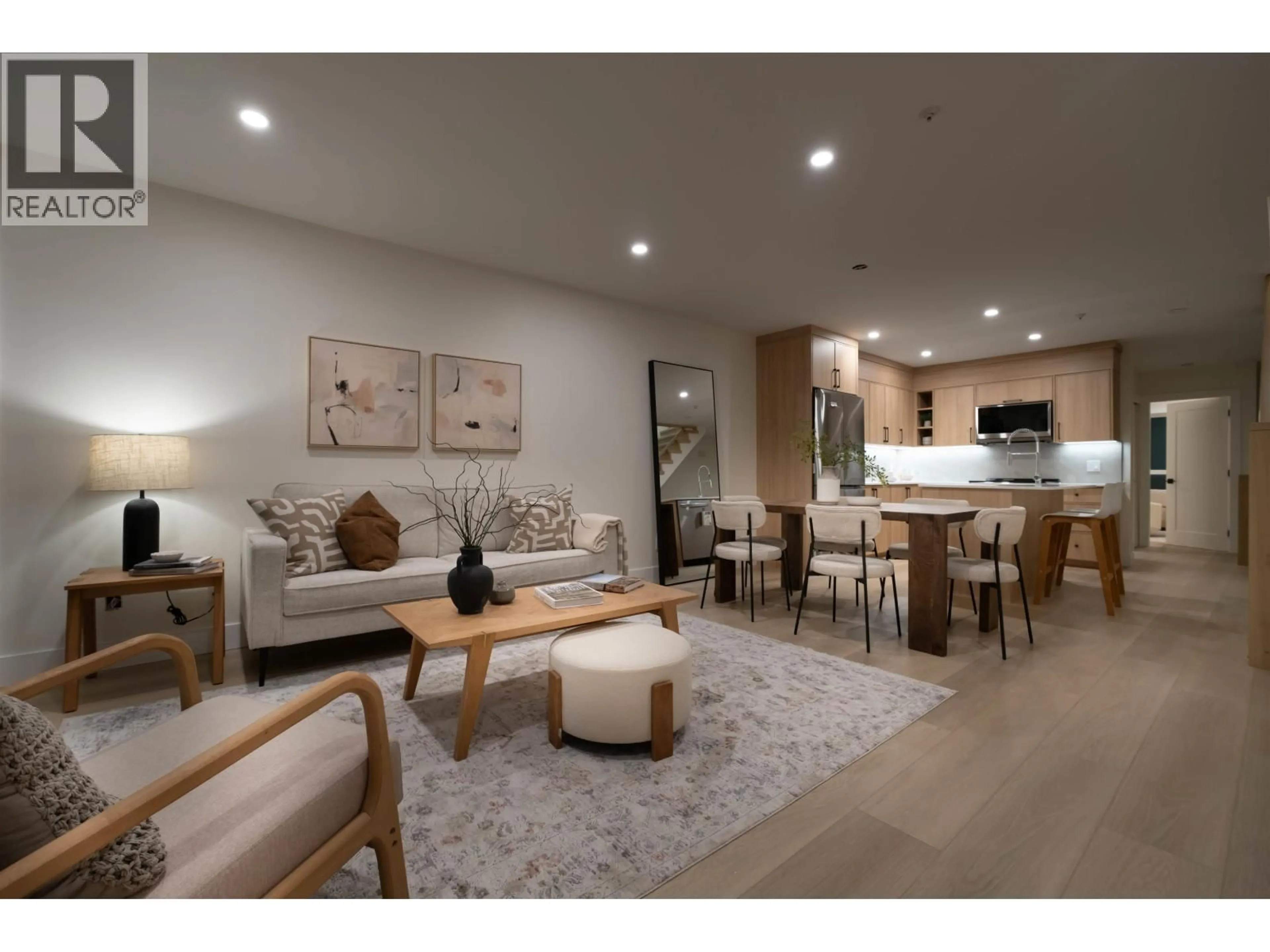 Living room with furniture, wood/laminate floor for 3350 COBBLESTONE AVENUE, Vancouver British Columbia V5S4S4