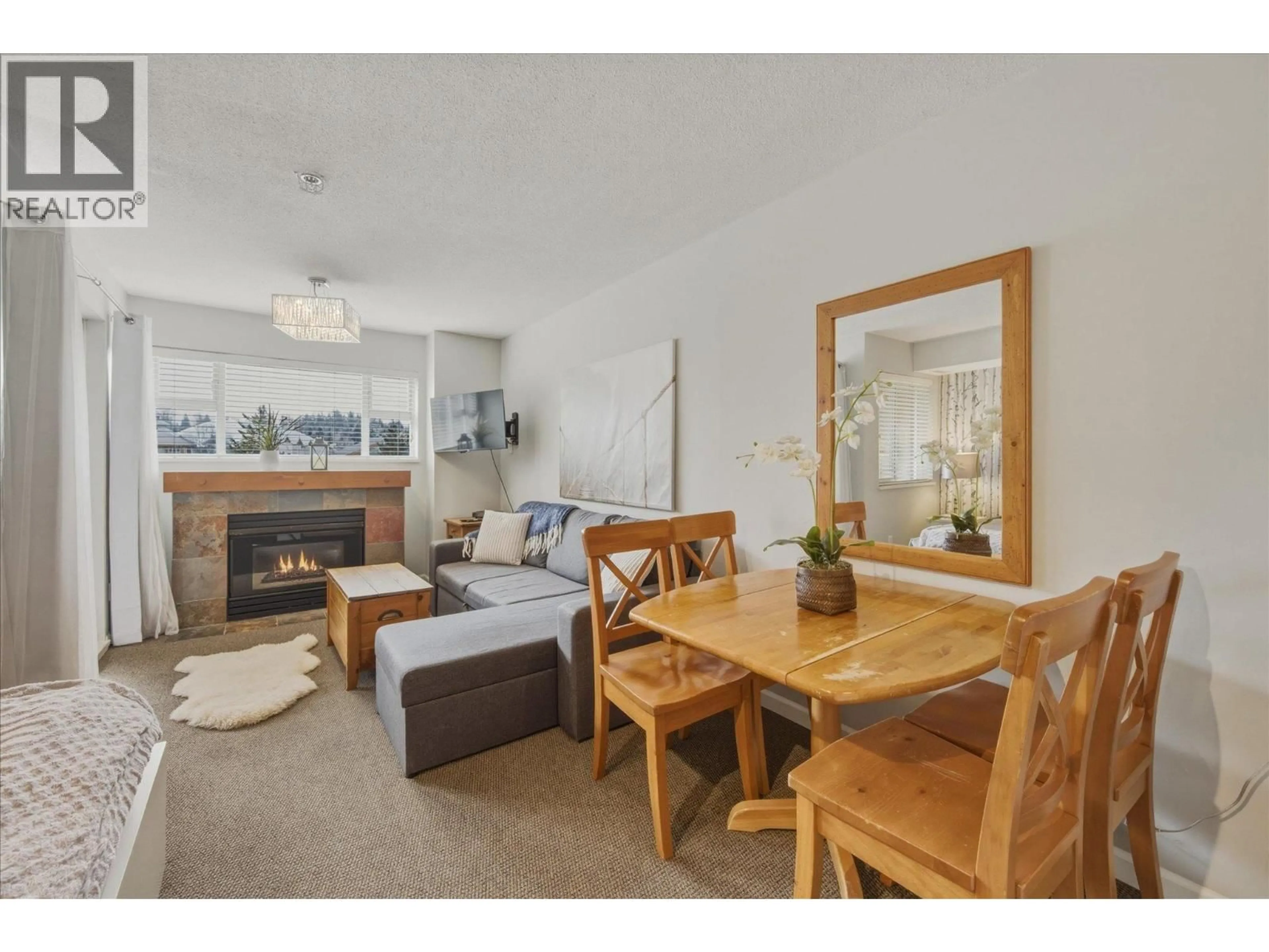 Living room with furniture, wood/laminate floor for 308 - 4360 LORIMER ROAD, Whistler British Columbia V8E1A5